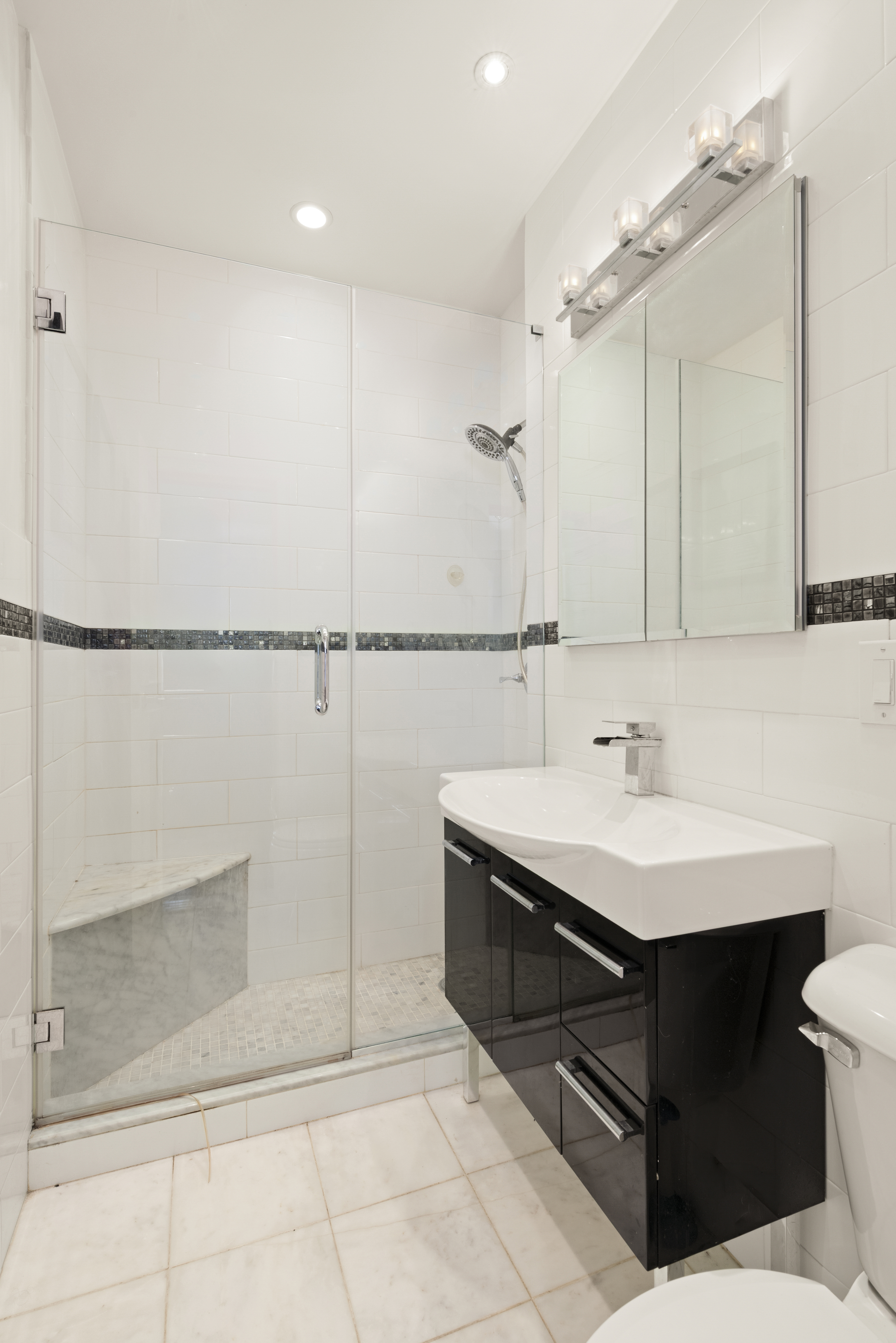 20 West 72nd Street, Unit 1600 Manhattan, NY 10023 - Photo 5 of 7 a bathroom with a sink and mirror