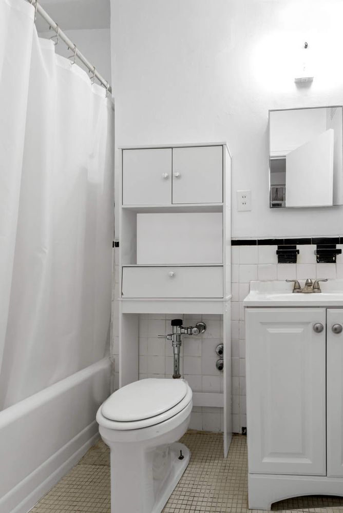215 East 88th Street, Unit 4A Manhattan, NY 10128 - Photo 10 of 11 a bathroom with a toilet a sink and bathtub