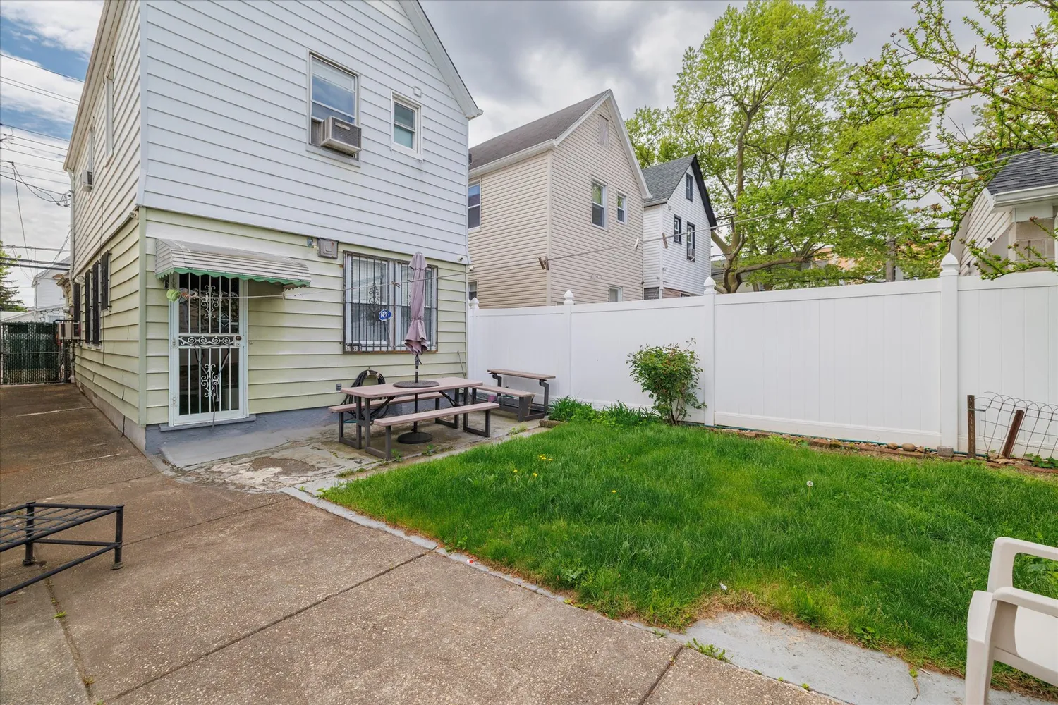 a view of a backyard with sitting area