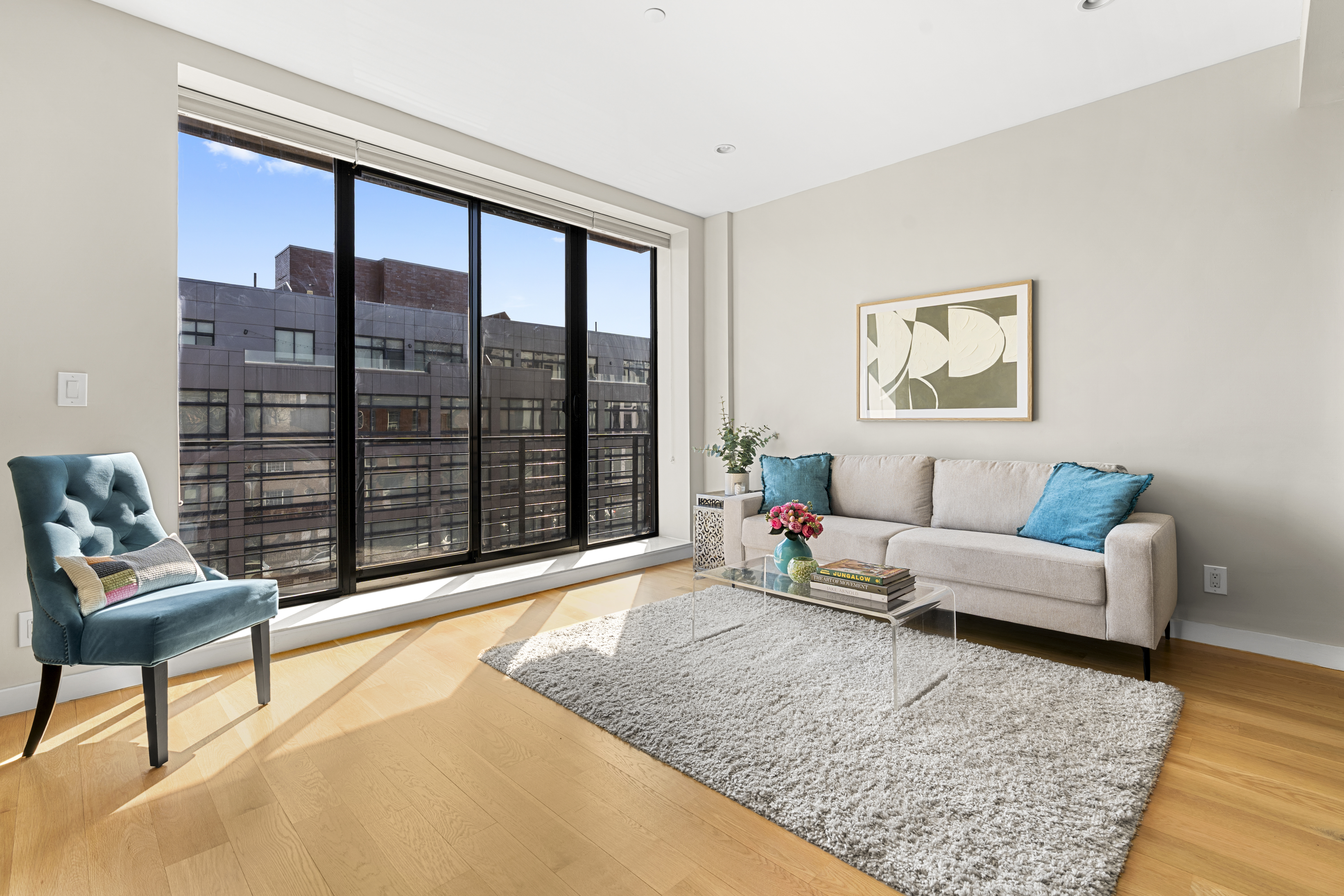 516 Classon Avenue, Unit 4A Brooklyn, NY 11238 - Photo 2 of 9 a living room with furniture and a floor to ceiling window