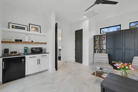 a kitchen that has a lot of cabinets and refrigerator