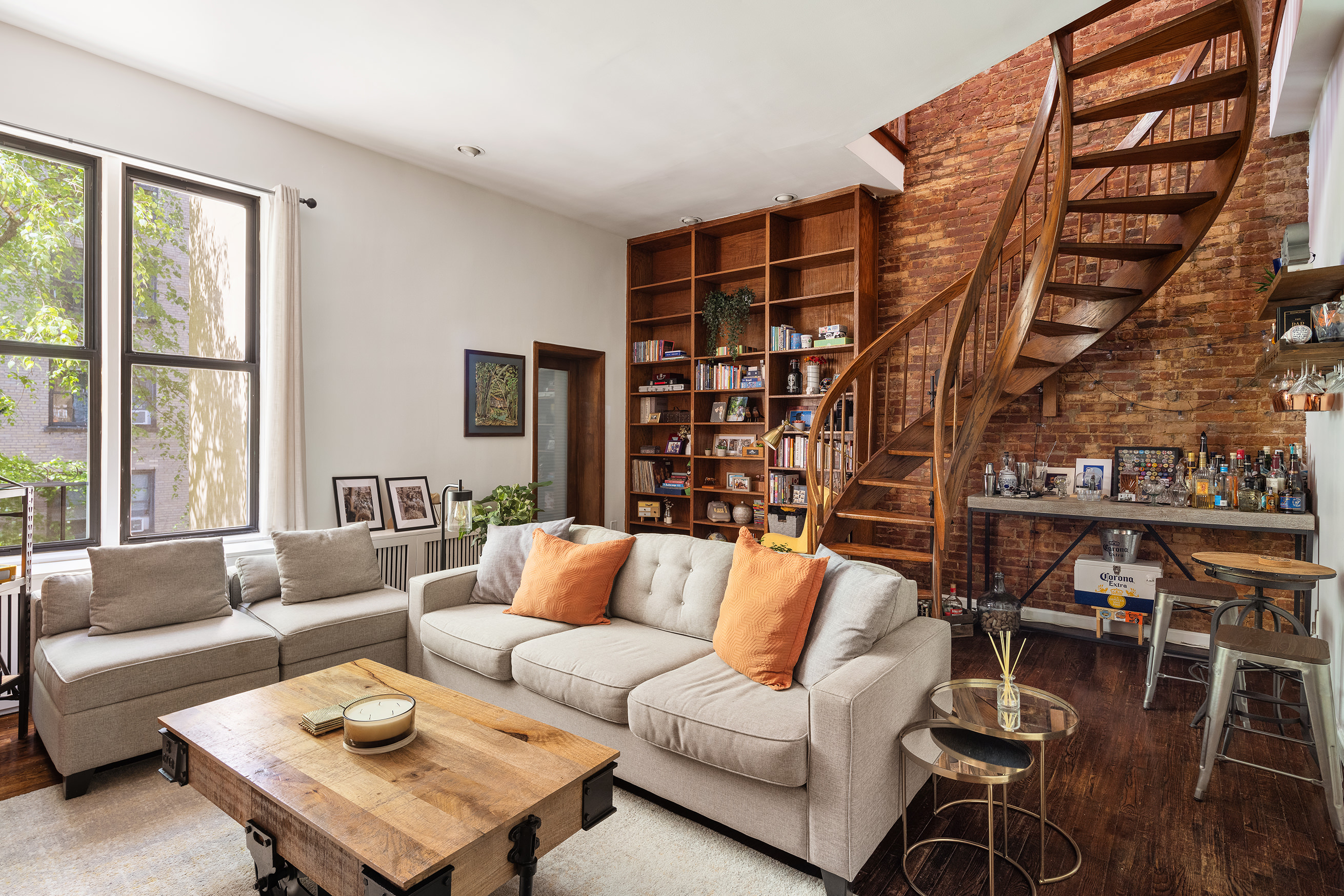 144 West 80th Street Manhattan, NY 10024 - Photo 14 of 22 a living room with furniture a rug and a large window