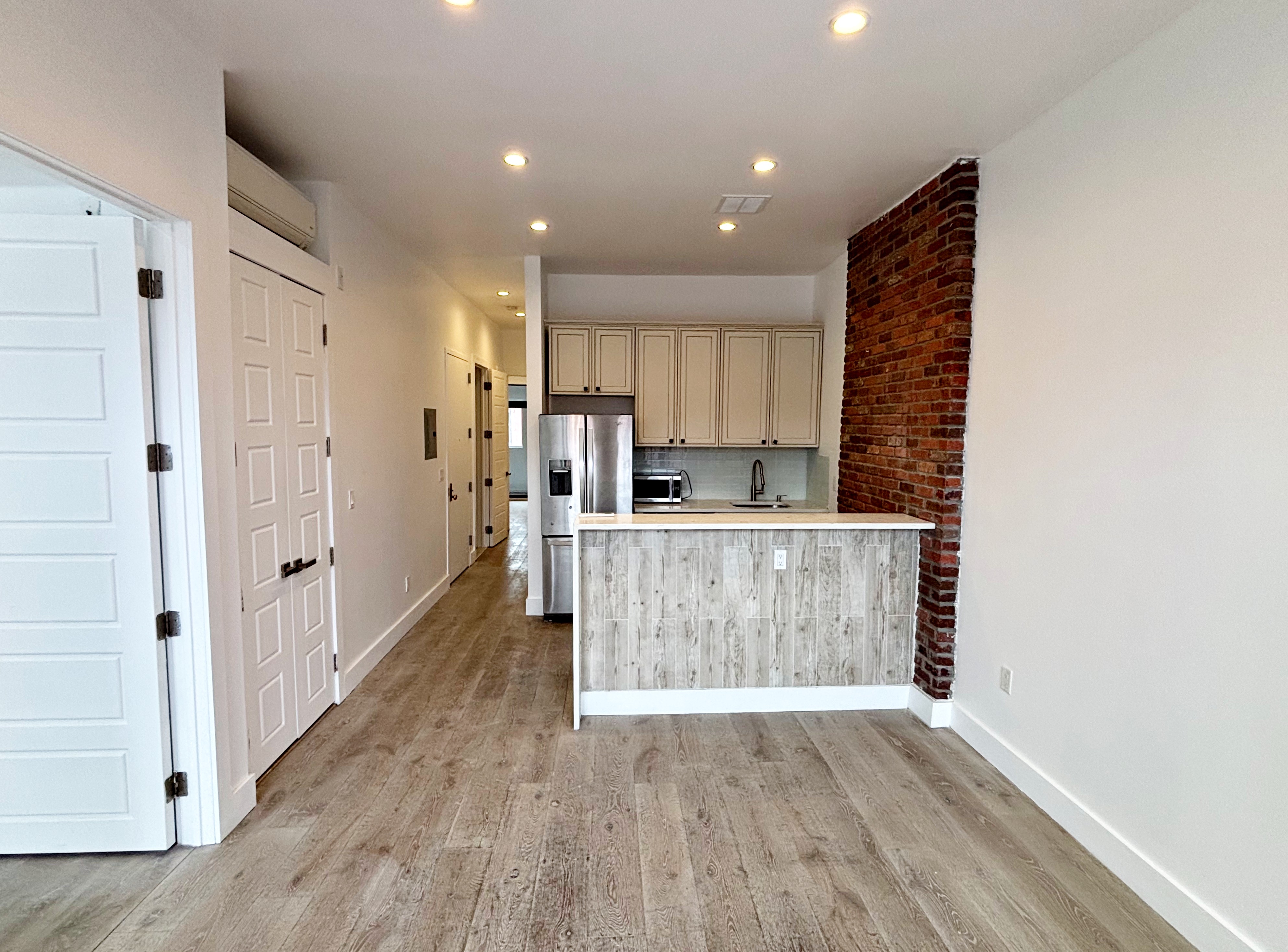 385 Nostrand Avenue, Unit Undisclosed Brooklyn, NY 11216 - Photo 17 of 27 a view of kitchen with refrigerator and window