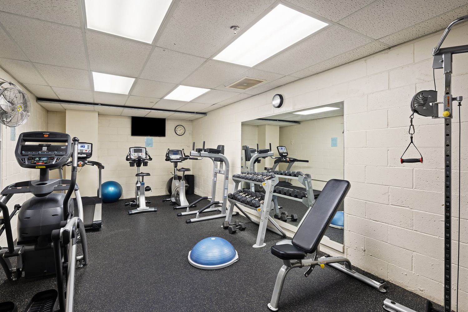 1255 5th Avenue, Unit 6D Manhattan, NY 10029 - Photo 10 of 15 a view of a room with gym equipment