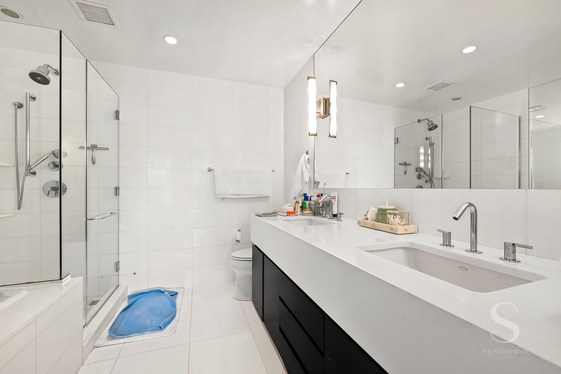 4 West 21st Street, Unit 14A Manhattan, NY 10010 - Photo 9 of 16 a bathroom with a sink and a mirror