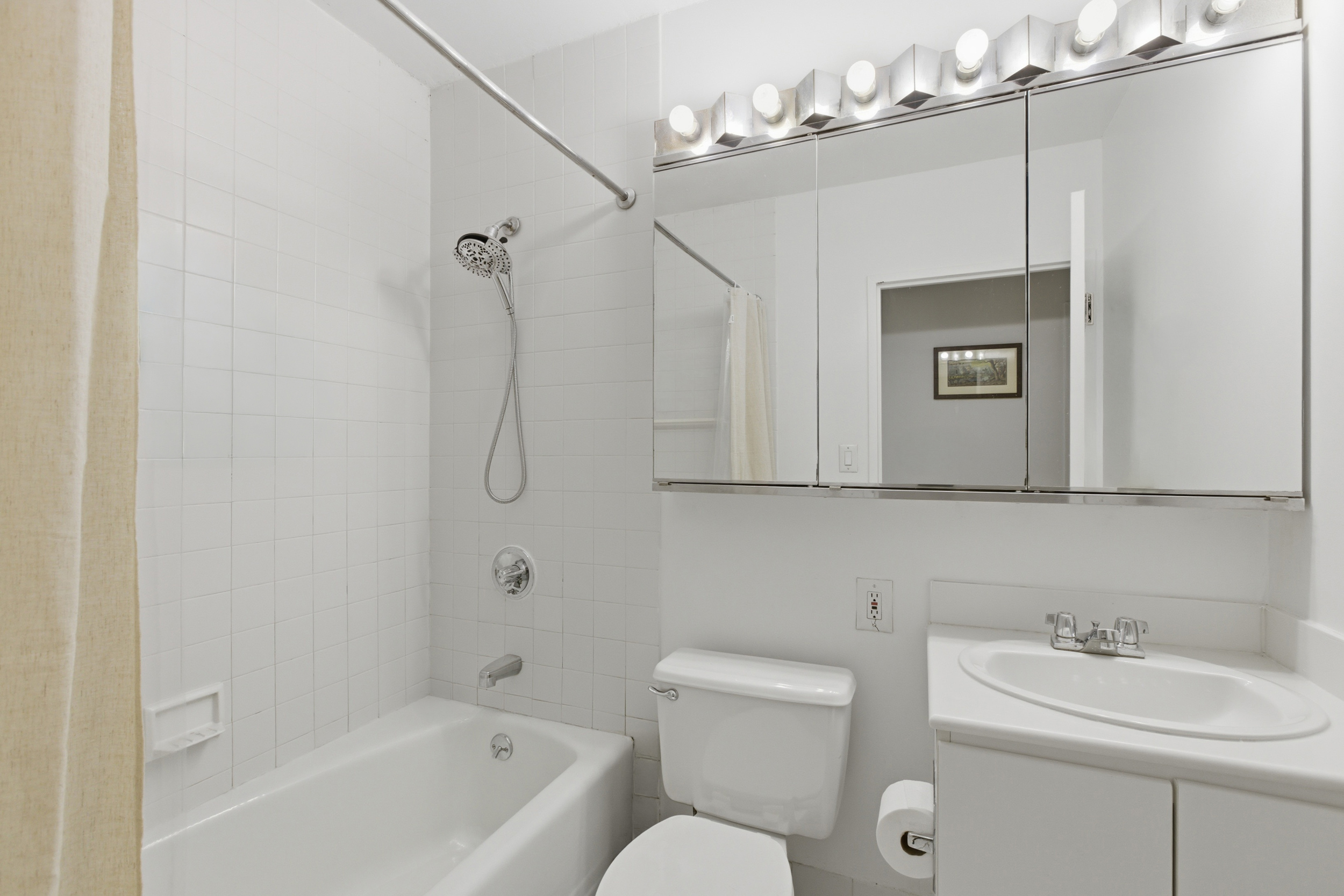 280 Park Avenue South, Unit 5L Manhattan, NY 10010 - Photo 9 of 17 a bathroom with a sink a toilet and shower