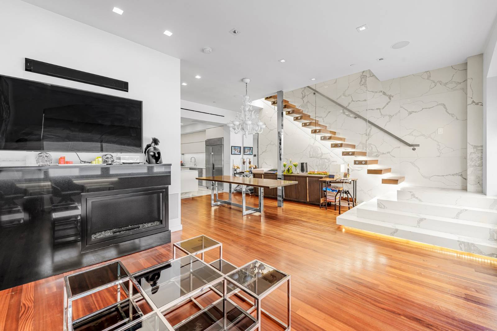 124 East 13th Street, Unit 3 Manhattan, NY 10003 - Photo 6 of 26 a lobby with furniture and flat screen tv