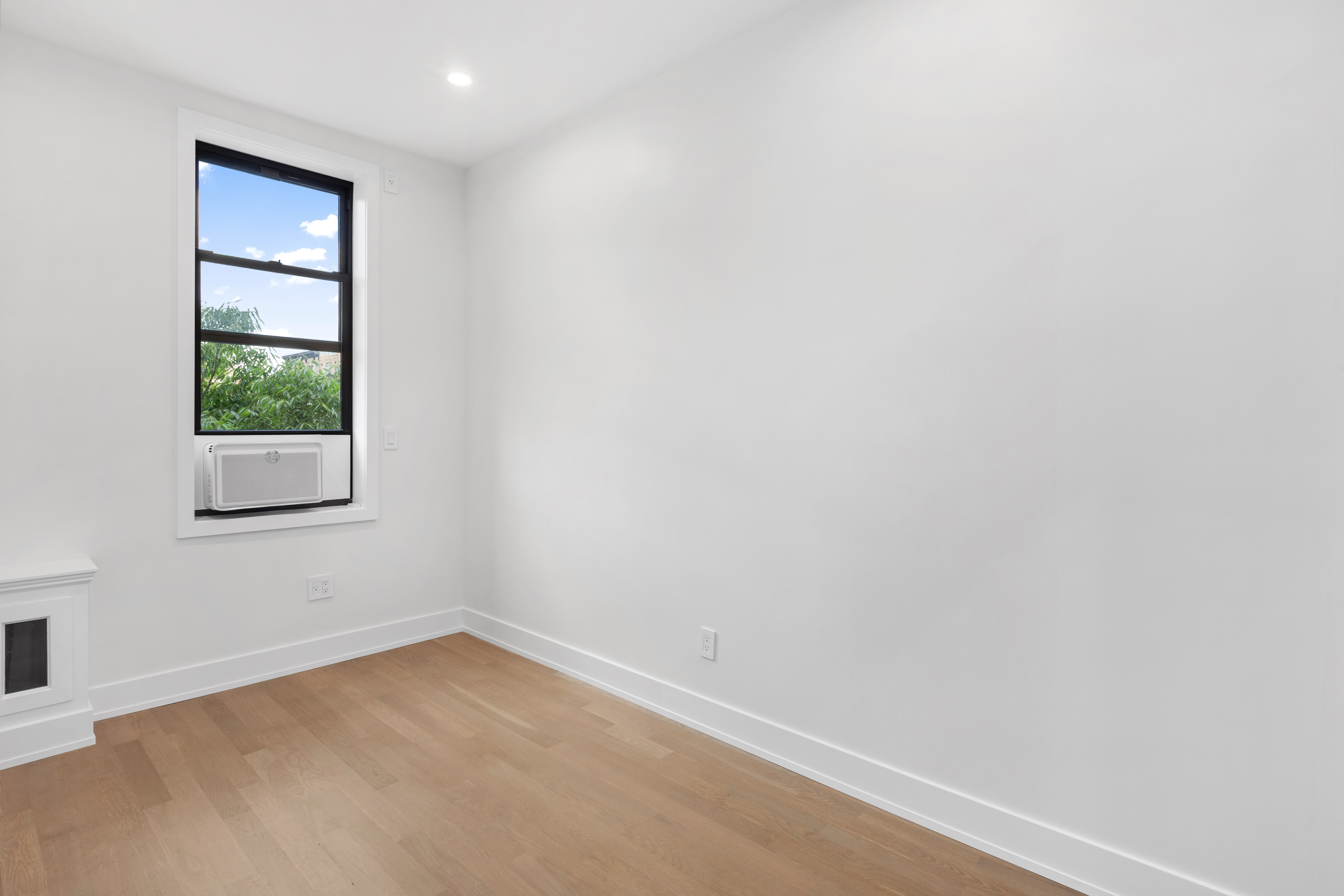 64 MacDougal Street, Unit 7 Manhattan, NY 10012 - Photo 4 of 5 a view of an empty room with a window