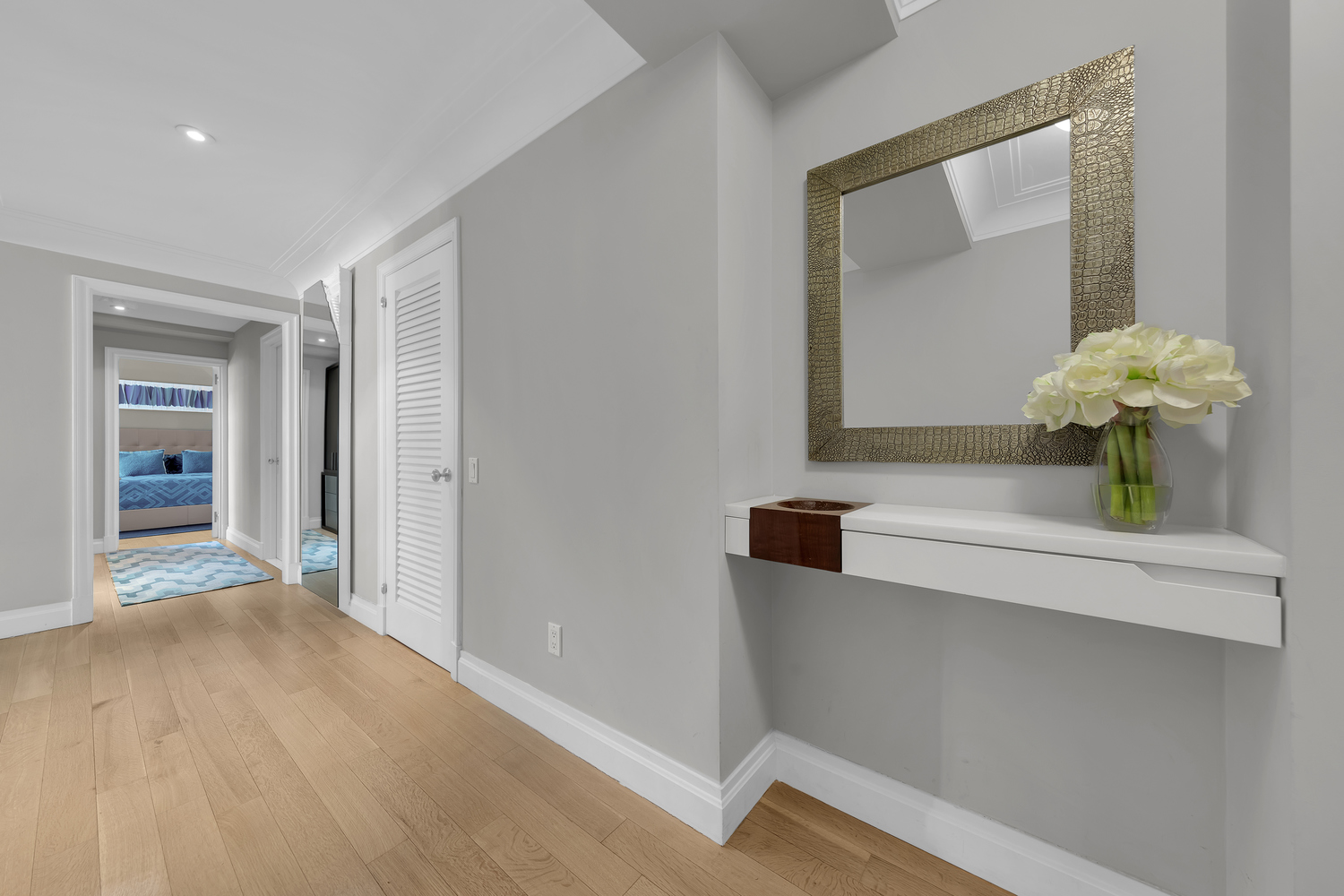 200 East 66th Street, Unit A407 Manhattan, NY 10065 - Photo 6 of 24 a bathroom with a sink and a mirror