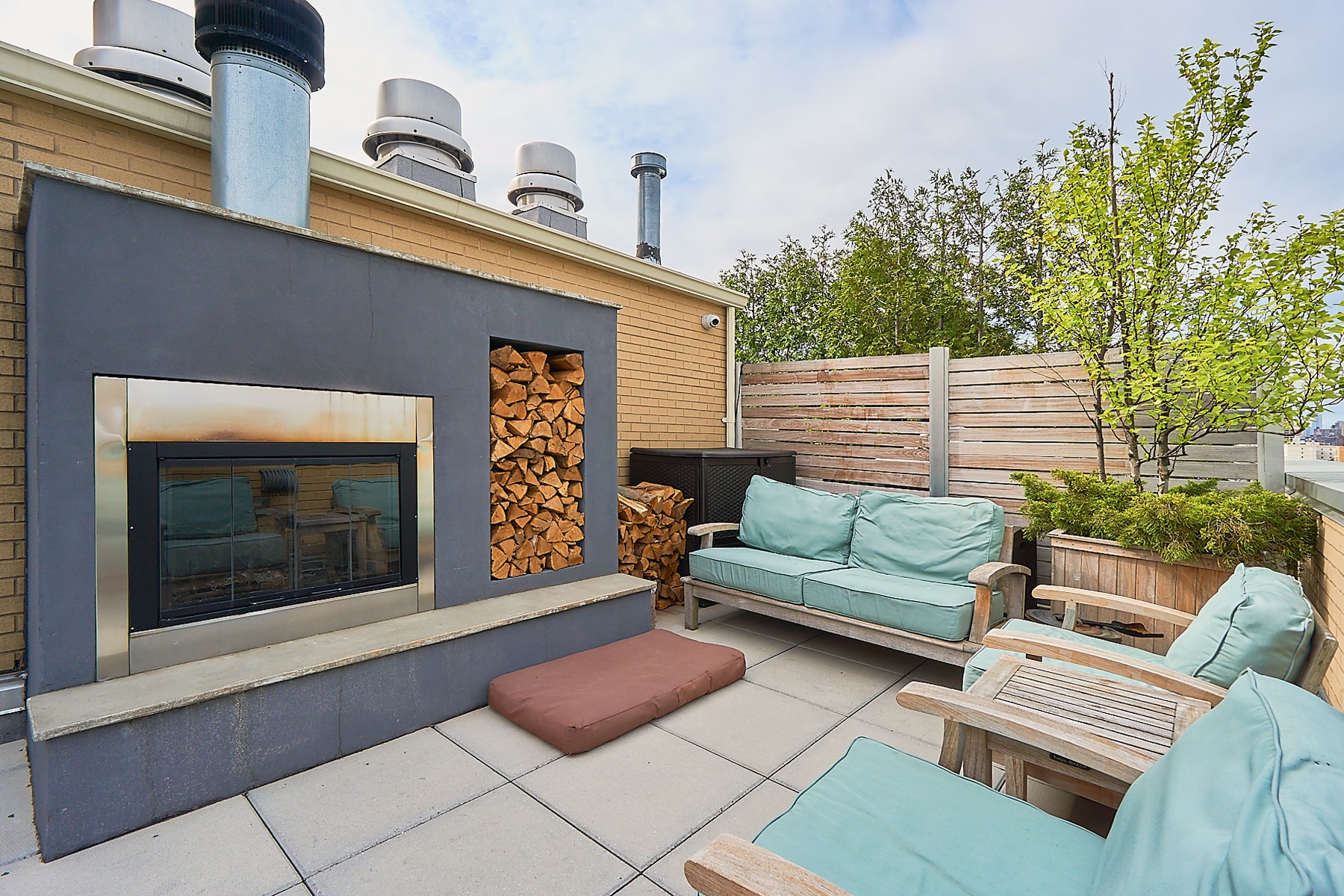 2280 Frederick Douglass Boulevard, Unit 5D Manhattan, NY 10027 - Photo 20 of 22 a outdoor living space with furniture and a fireplace