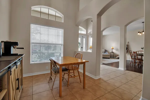 a kitchen with stainless steel appliances kitchen island granite countertop a refrigerator and microwave