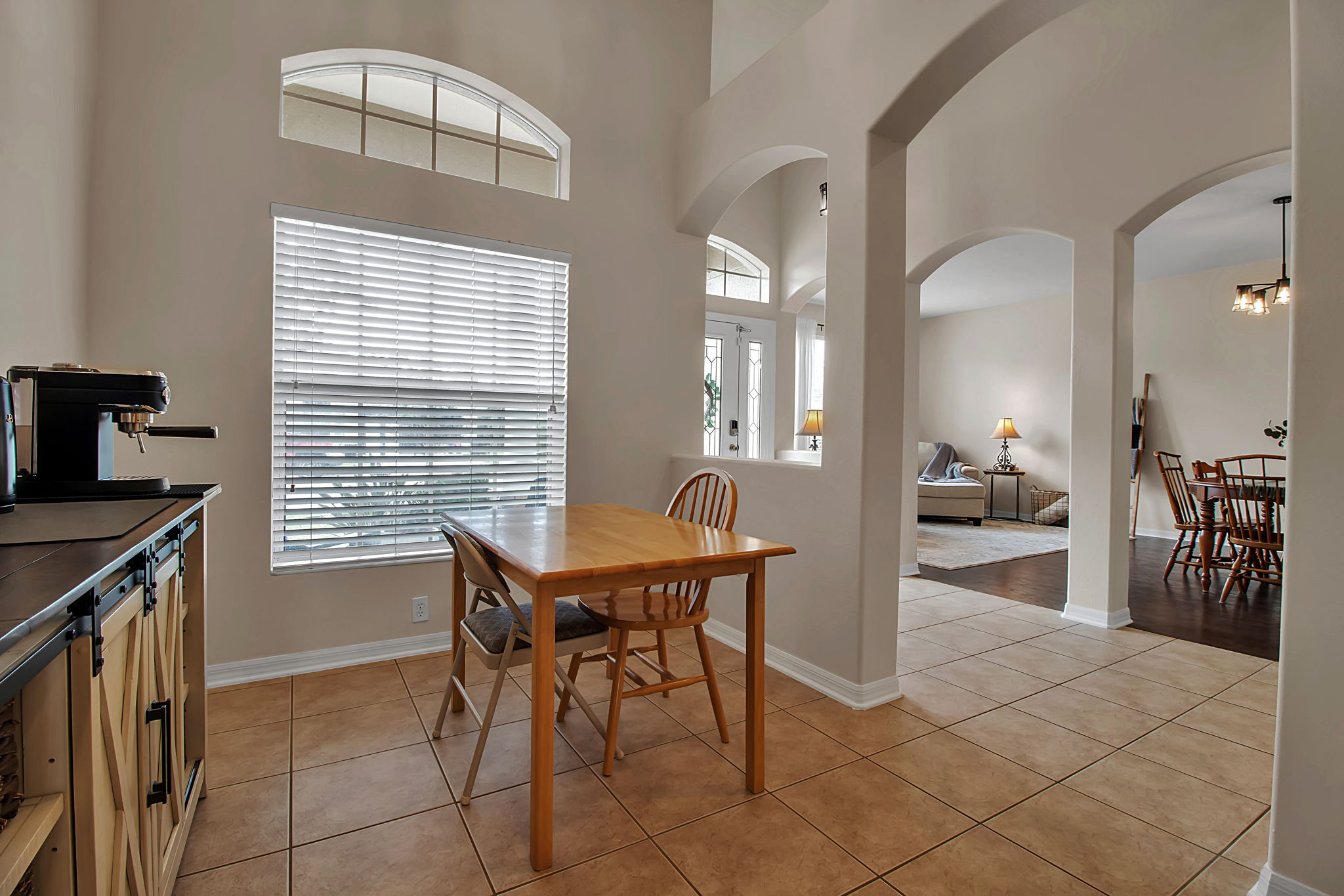 6106 34th Court East Bradenton, FL 34203 - Photo 20 of 69 a view of a dining room with furniture and a large window
