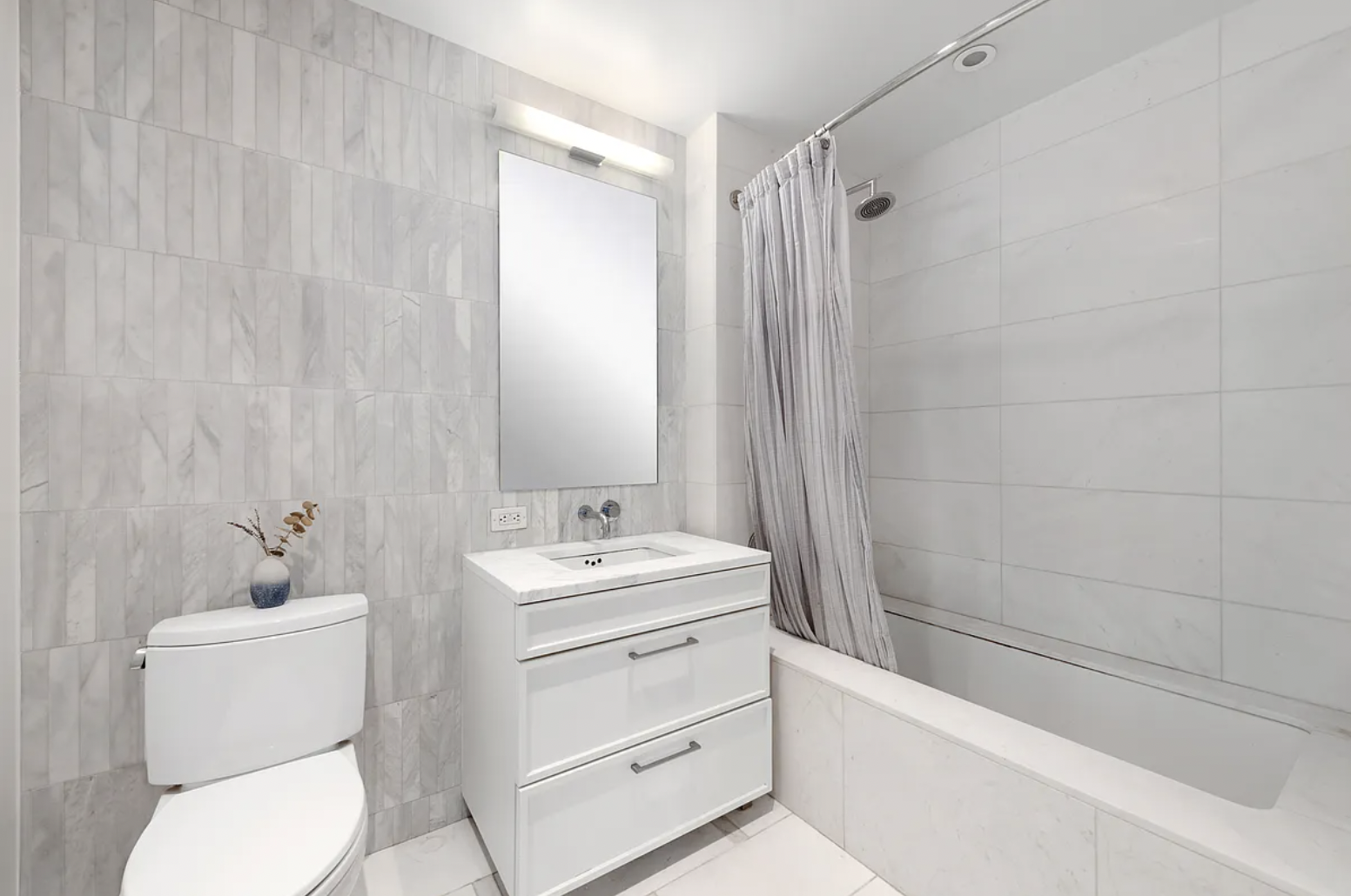 160 East 22nd Street, Unit 4D Manhattan, NY 10010 - Photo 6 of 15 a bathroom with a toilet a sink and a bathtub