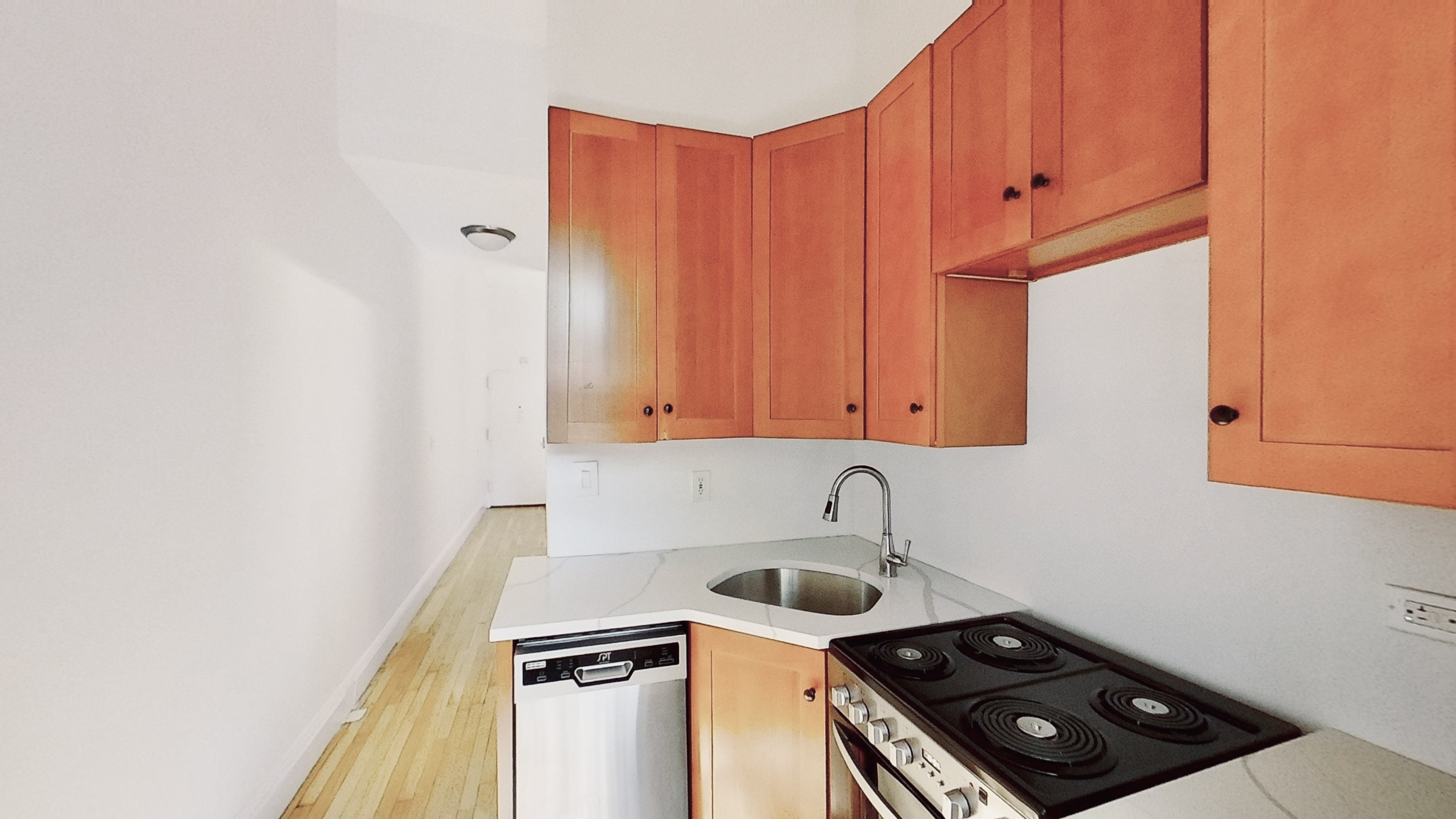347 5th Avenue, Unit 1L Brooklyn, NY 11215 - Photo 5 of 10 a kitchen with a sink a stove and cabinets