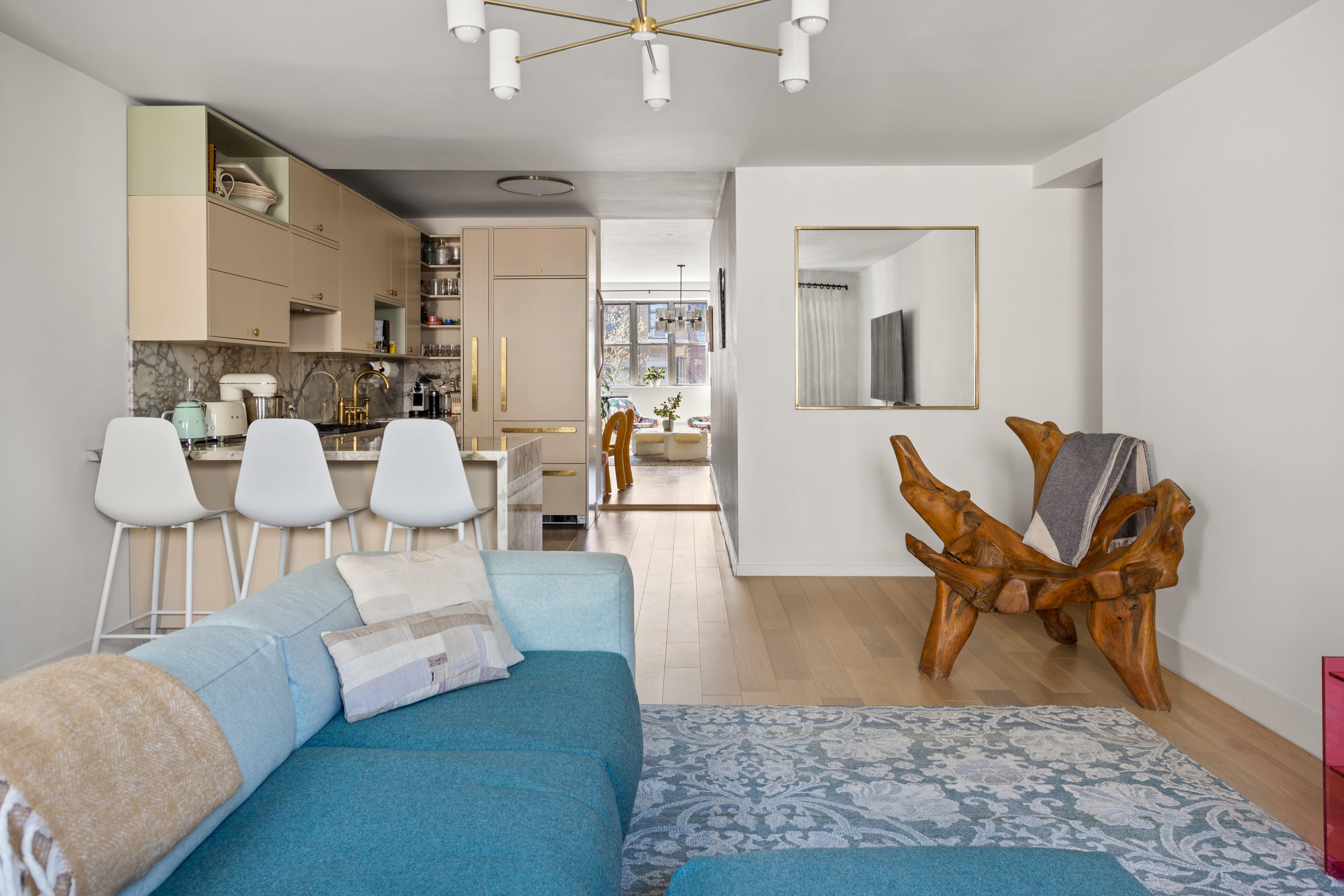 537 East 6th Street, Unit 5 Manhattan, NY 10009 - Photo 8 of 12 a living room with furniture and wooden floor