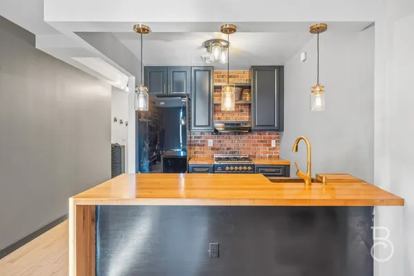 a bathroom with a sink vanity and a mirror