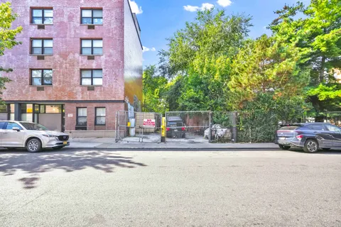 a view of street with parked cars