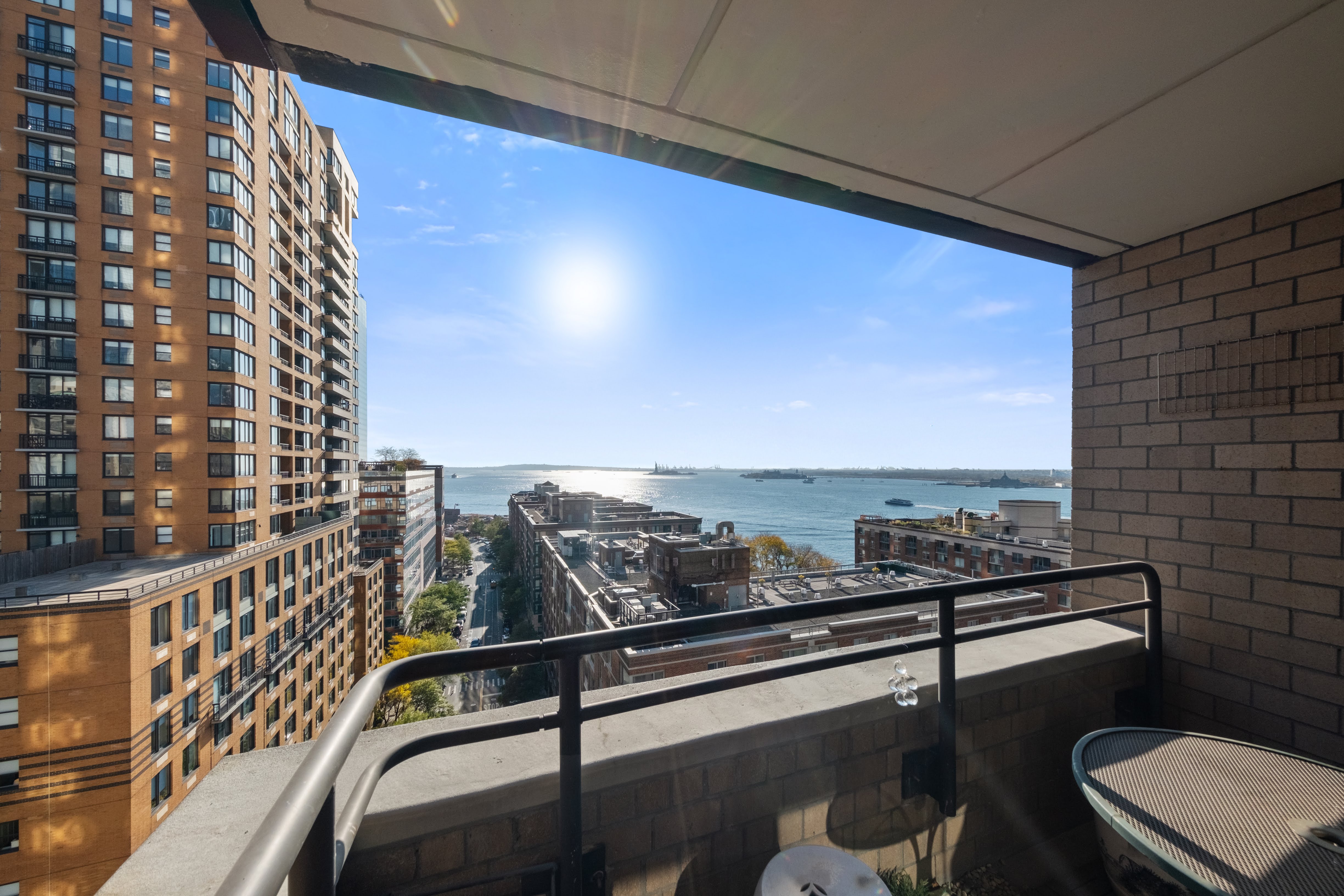 200 Rector Place, Unit 16F Manhattan, NY 10280 - Photo 1 of 25 a view of a balcony with chairs