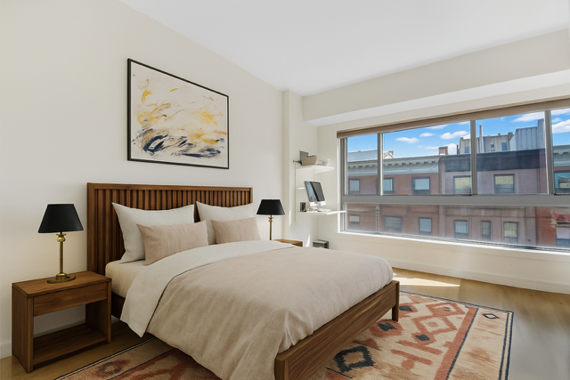171 West 131st Street, Unit 603 Manhattan, NY 10027 - Photo 3 of 7 a bedroom with a bed and glass window