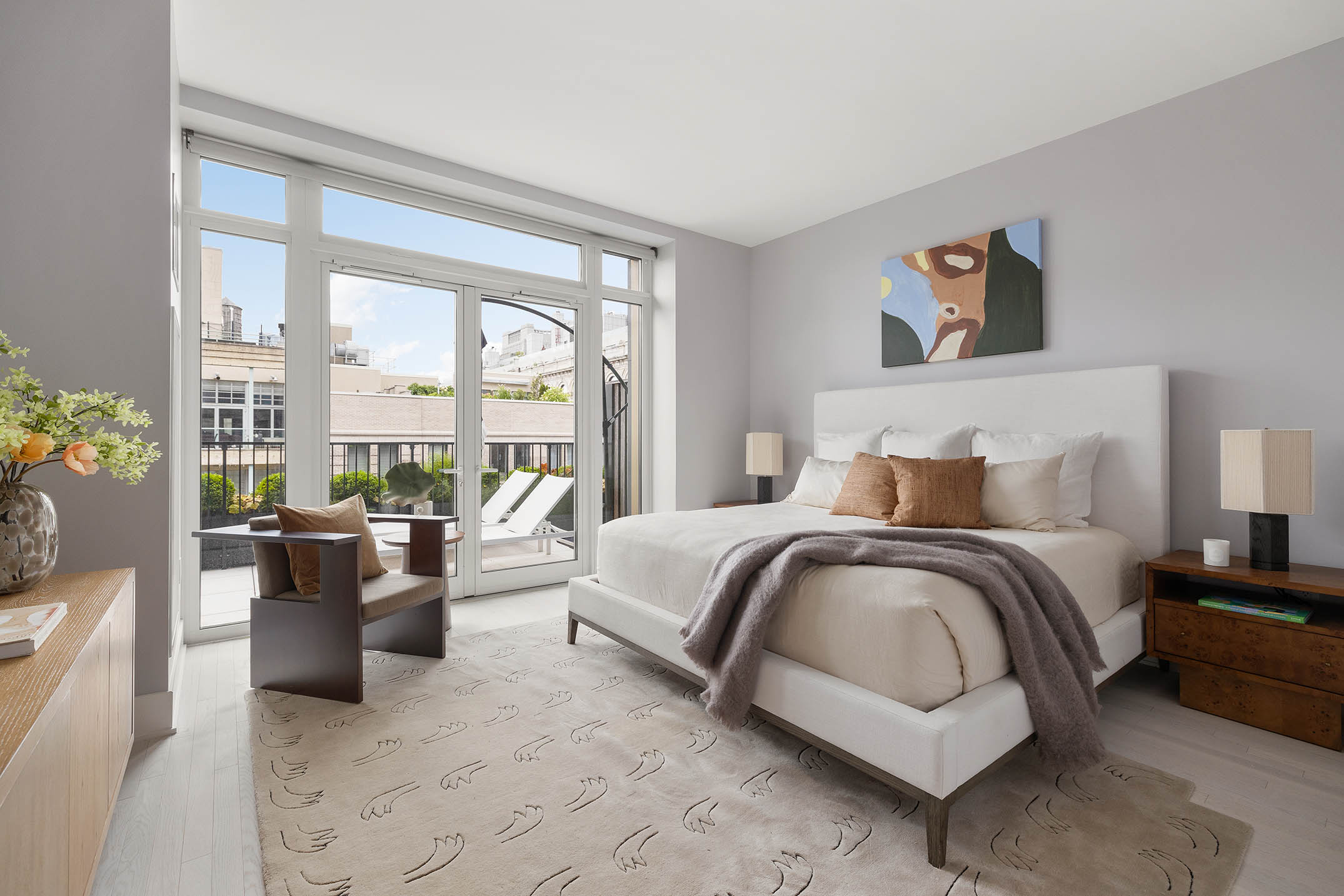 91 Leonard Street, Unit 14A Manhattan, NY 10013 - Photo 10 of 27 a spacious bedroom with a bed and large windows