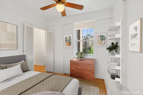 a bedroom with furniture and a potted plant