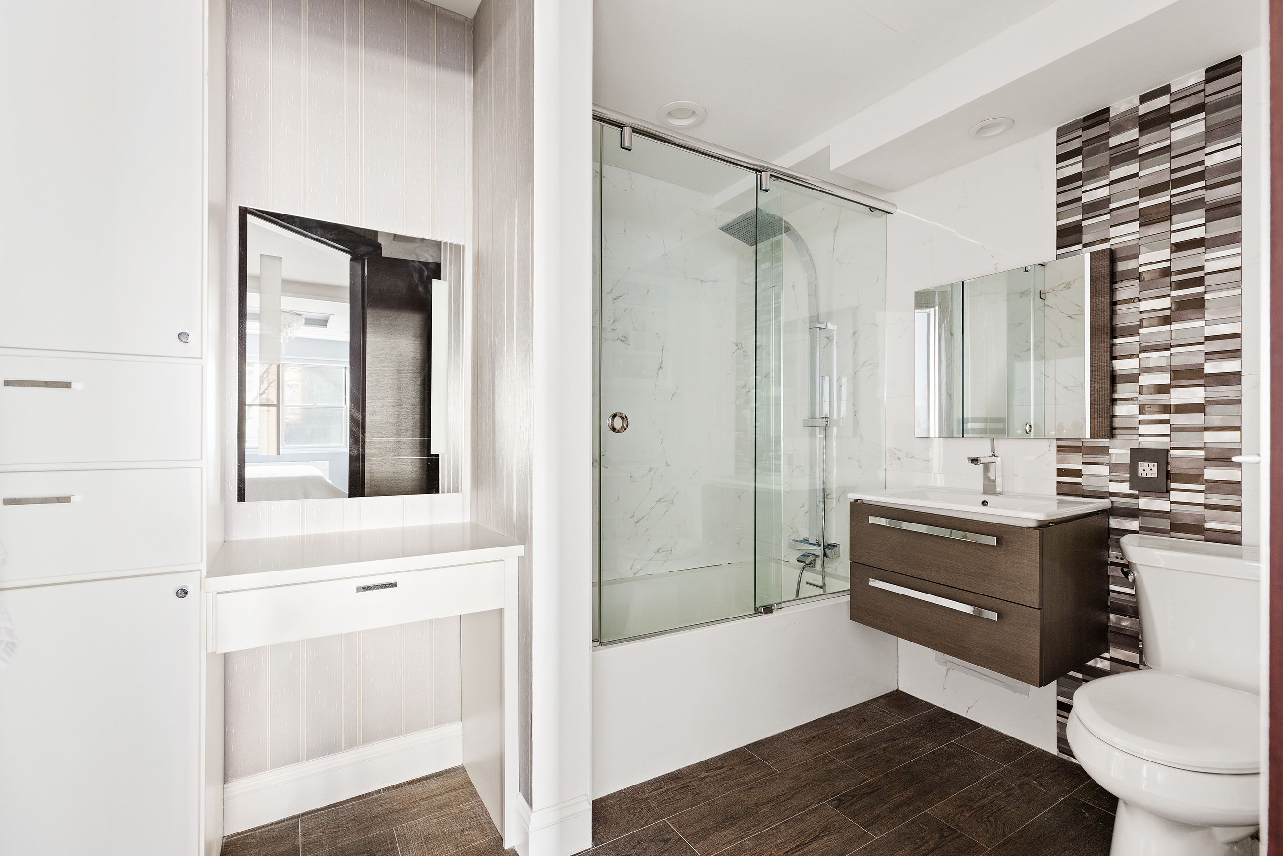 70 East 10th Street, Unit 3B Manhattan, NY 10003 - Photo 8 of 11 a bathroom with a sink a toilet and shower