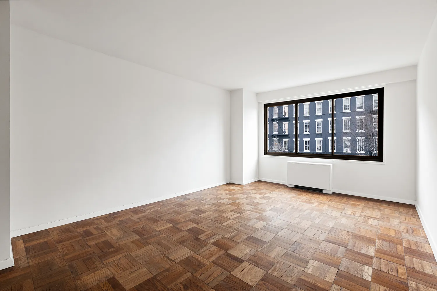 a view of an empty room with a window