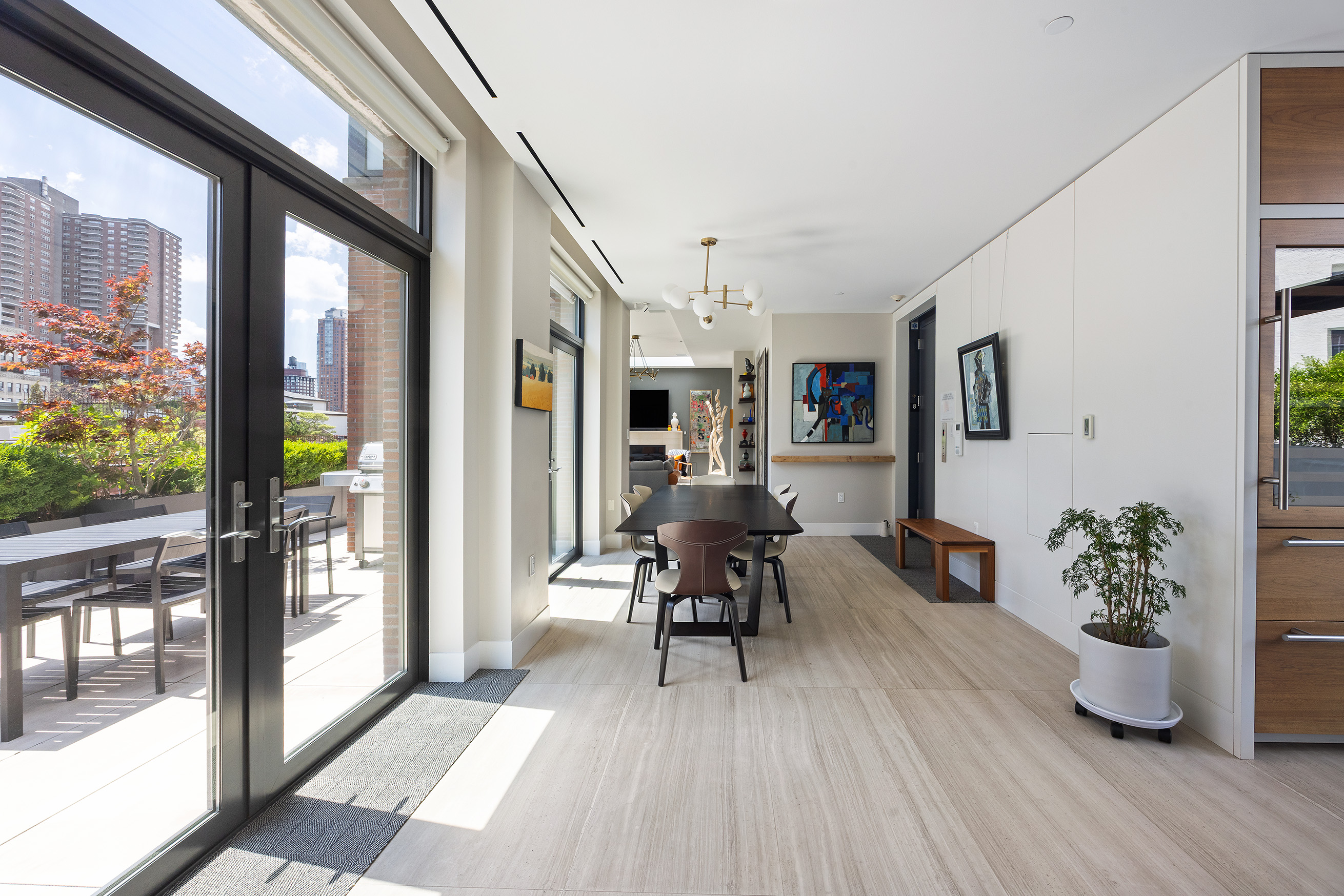 15 Leonard Street, Unit PH Manhattan, NY 10013 - Photo 13 of 37 a view of a dining room with furniture window and wooden floor