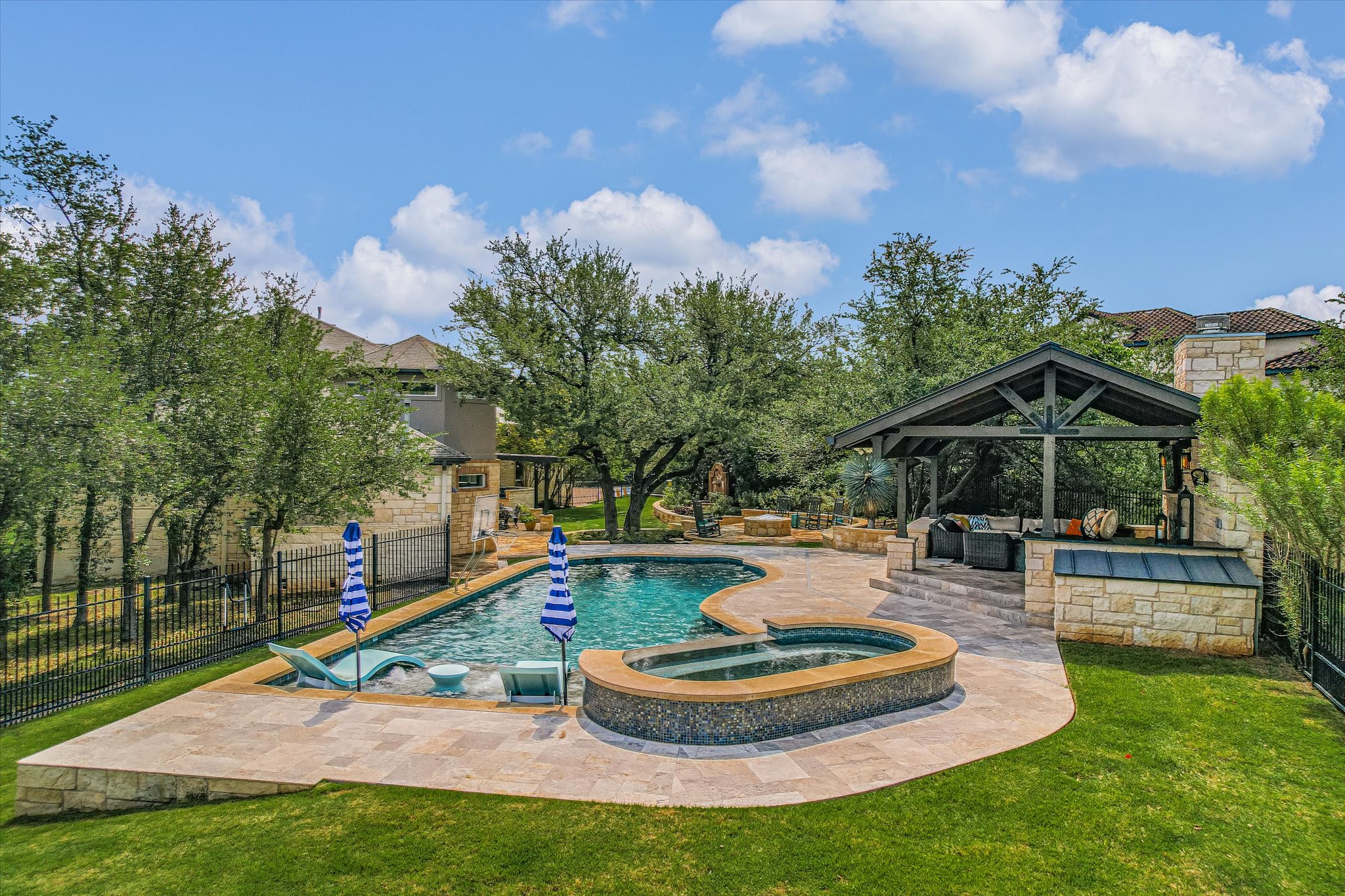 1422 Palomino Ridge Drive Austin, TX 78733 - Photo 50 of 60 a view of a house with backyard and sitting area