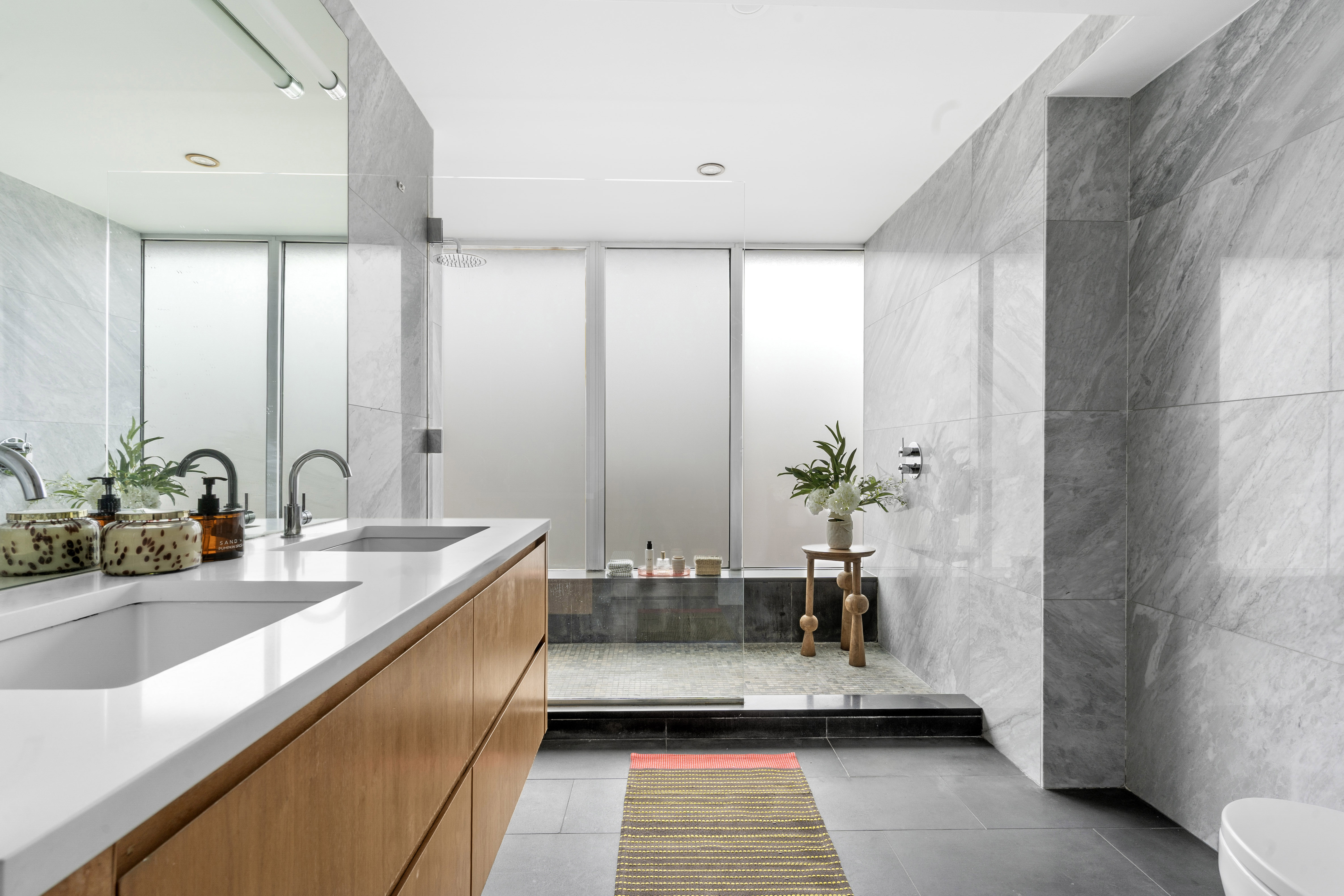 142 North 1st Street, Unit PH Brooklyn, NY 11249 - Photo 9 of 15 a bathroom with double vanity and a bathtub