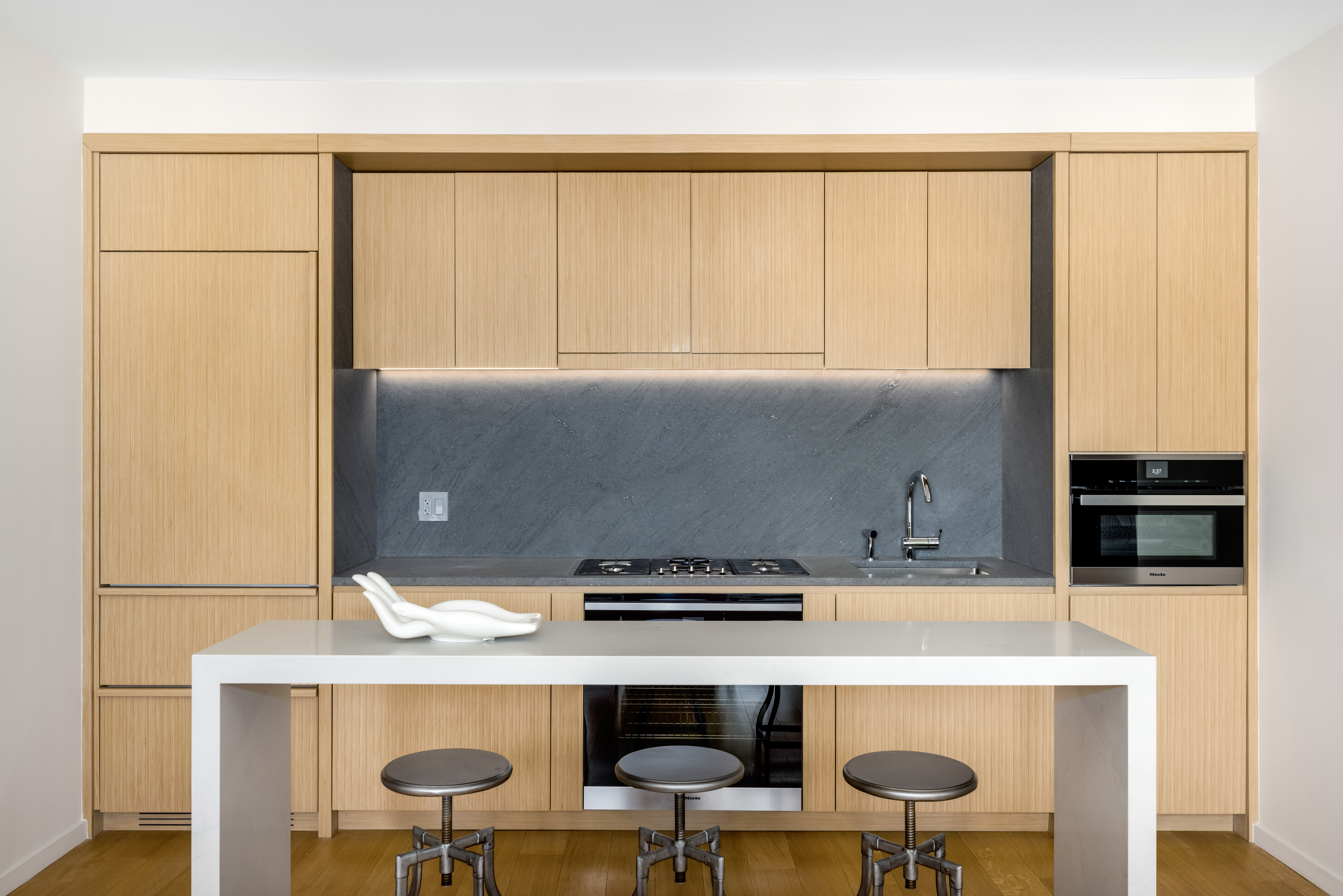 565 Broome Street, Unit N11D Manhattan, NY 10013 - Photo 3 of 18 a kitchen with a cabinets a stove and a refrigerator