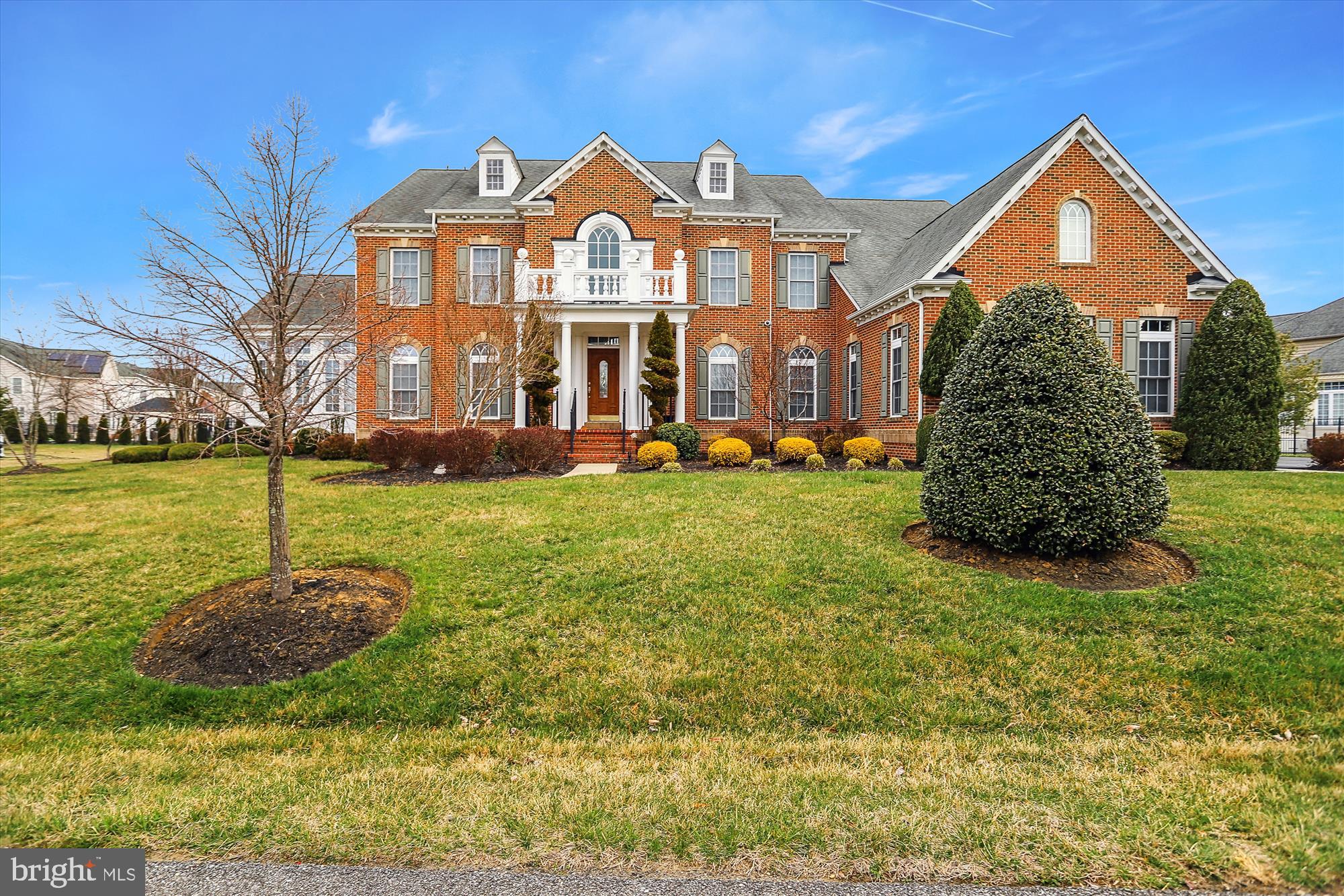 14302 Derby Ridge Road Bowie, MD 20721 - Photo 1 of 67 a view of a big house with a big yard and large trees