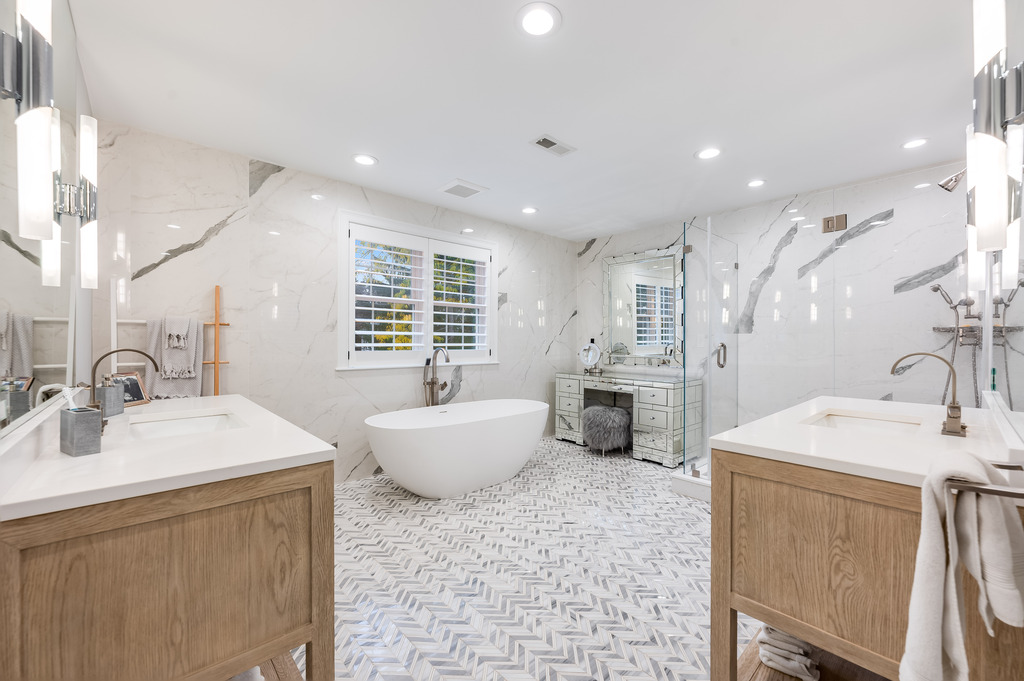 45 Washburn Avenue Needham, MA 02492 - Photo 11 of 23 a spacious bathroom with a double vanity sink mirror and bathtub