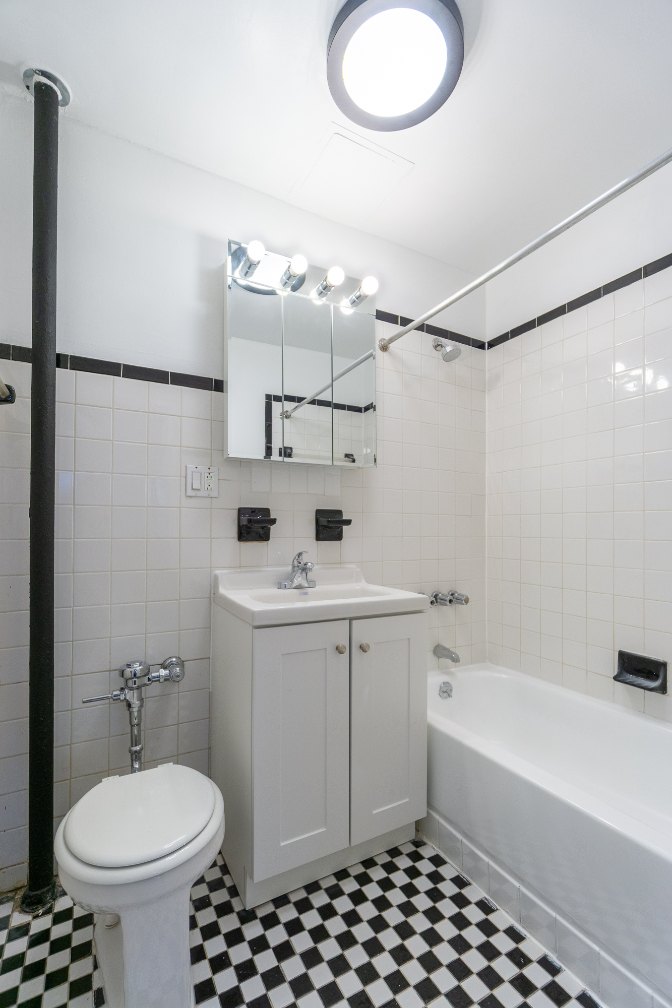 319 East 5th Street, Unit 13 Manhattan, NY 10003 - Photo 6 of 13 a bathroom with a sink toilet and shower