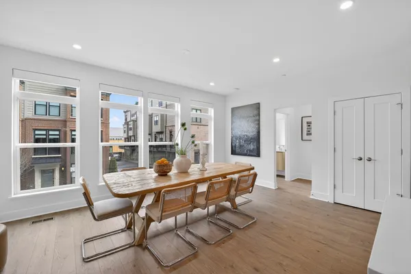 a dining room with furniture and window