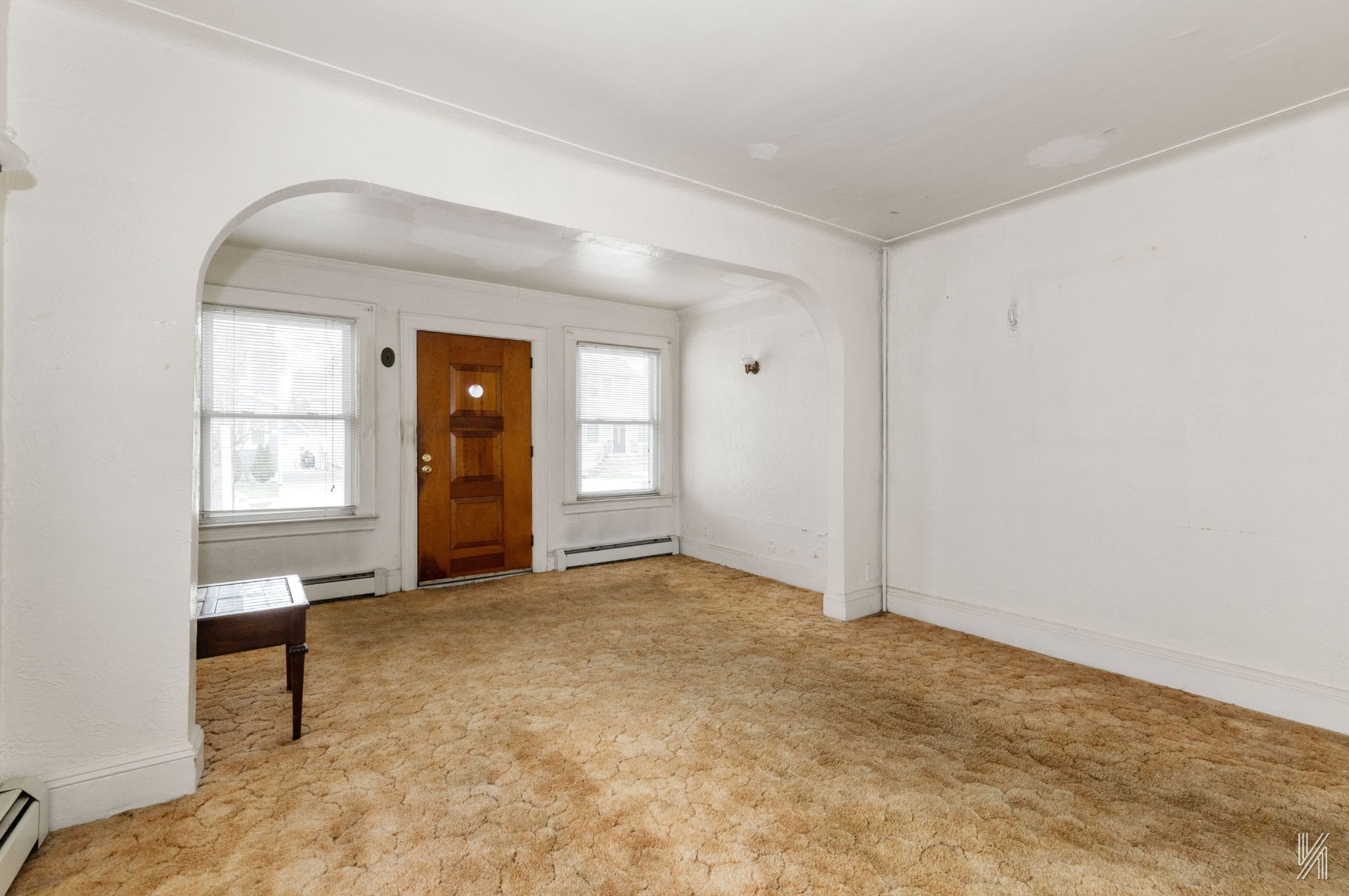 135-16 95th Street Queens, NY 11417 - Photo 4 of 21 an empty room with windows and closet