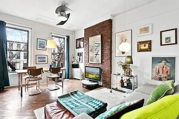 393 Clermont Avenue, Unit 3 Brooklyn, NY 11238 - Photo 1 of 10 a living room with furniture and a window