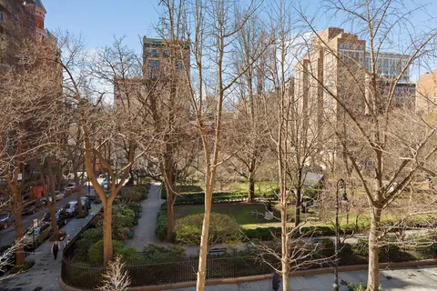 a backyard of a house with lots of trees