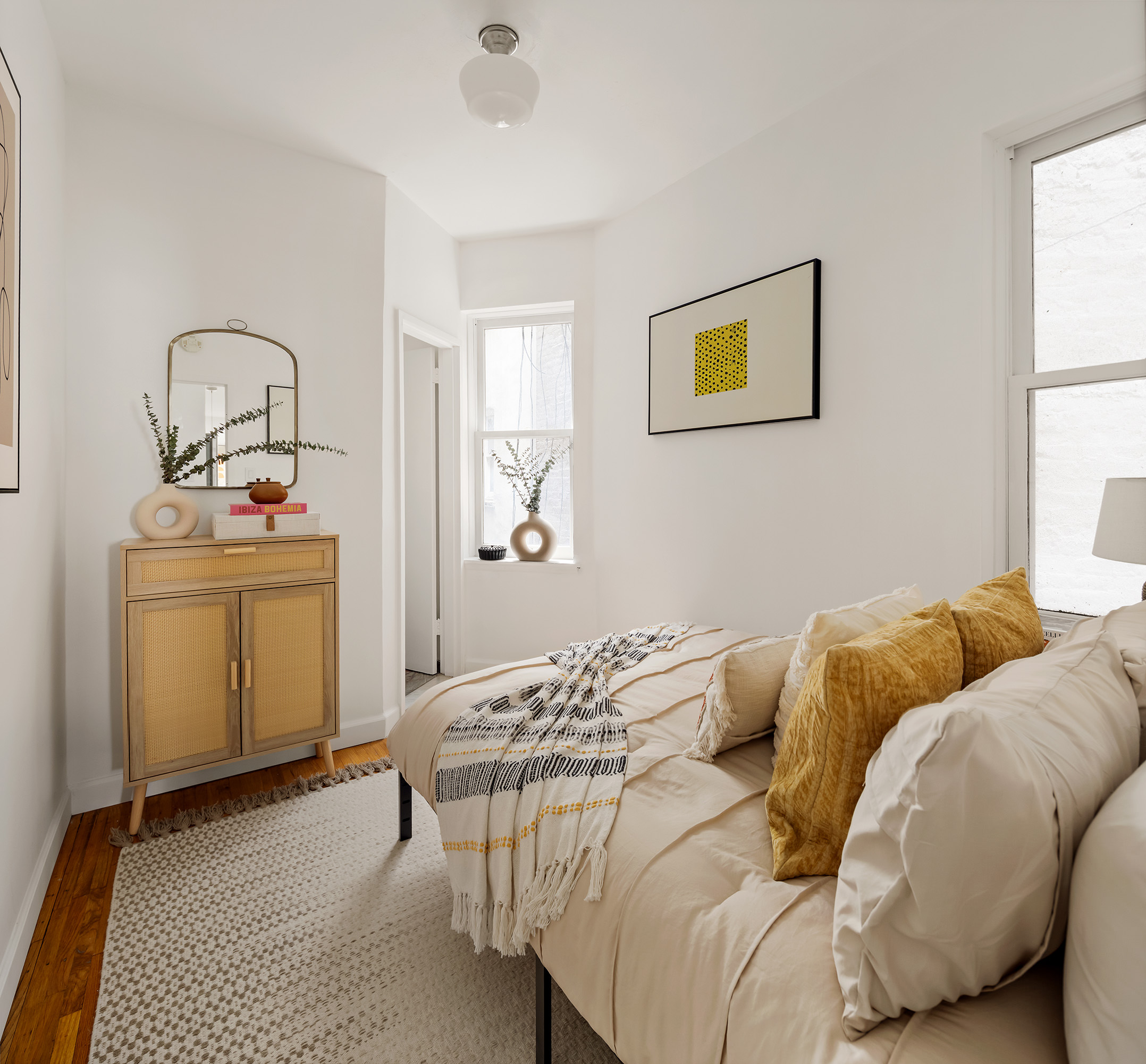 333 West 21st Street, Unit 2FE Manhattan, NY 10011 - Photo 4 of 10 a bedroom with a bed and a window