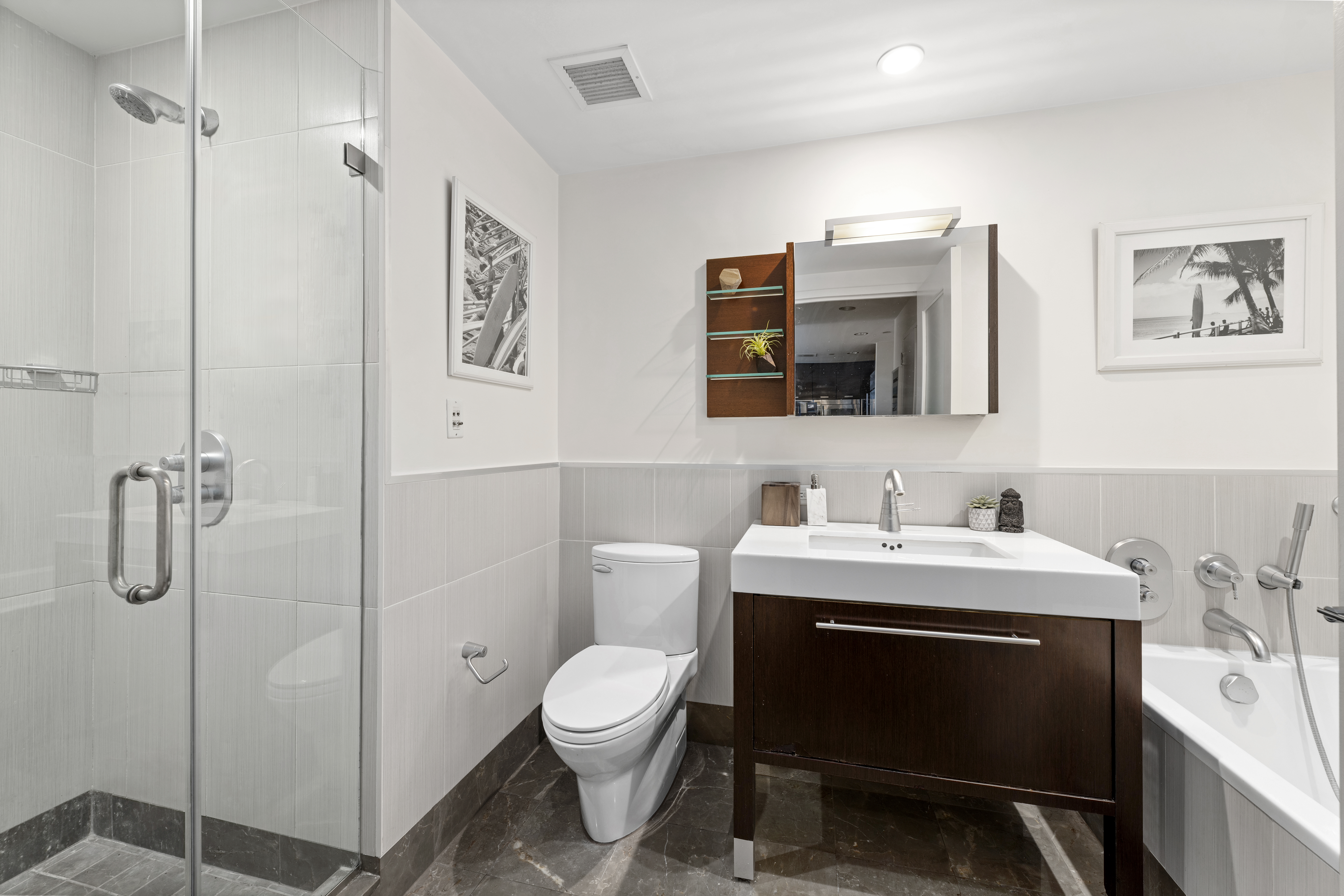 225 East 34th Street, Unit 14J Manhattan, NY 10016 - Photo 7 of 19 a bathroom with a sink toilet and shower