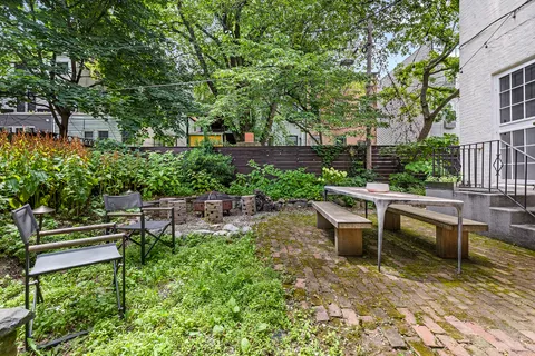 a view of a bench in a garden