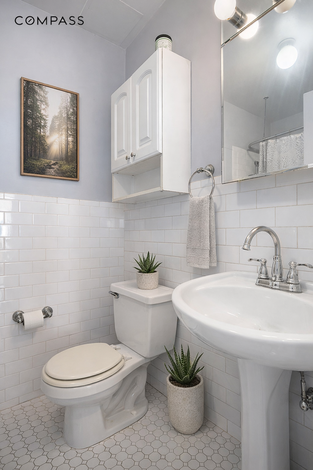 119 West 80th Street, Unit 3F Manhattan, NY 10024 - Photo 5 of 7 a bathroom with a toilet a sink and mirror