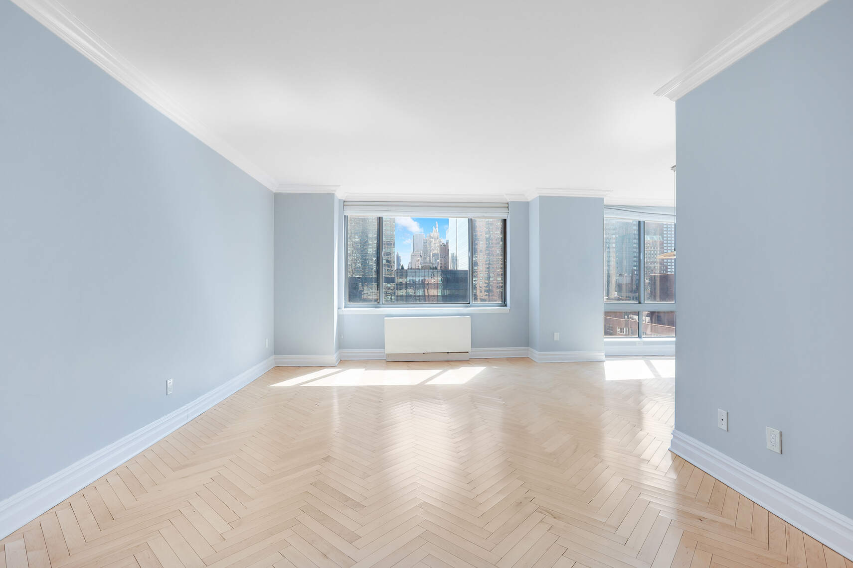 2 Columbus Avenue, Unit 17C Manhattan, NY 10023 - Photo 12 of 26 a view of an empty room with a window