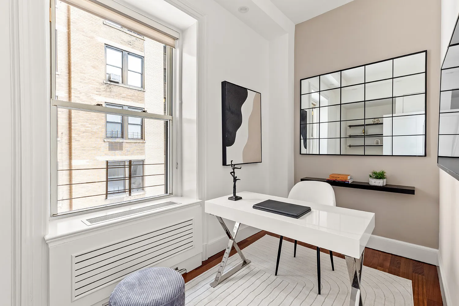 a workspace with furniture and window