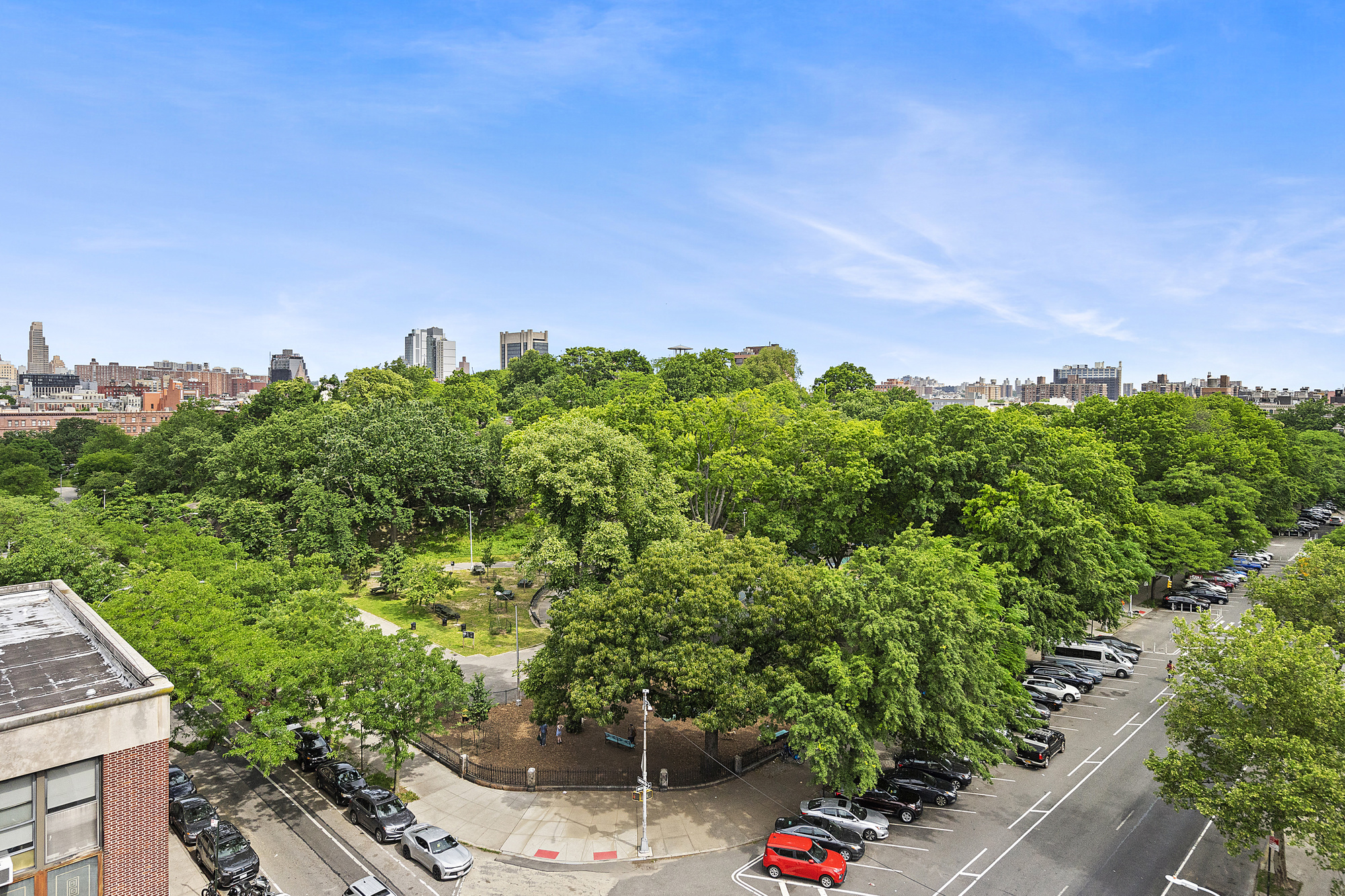 1831 Madison Avenue, Unit 9E Manhattan, NY 10035 - Photo 3 of 18 a view of a garden with a house in the background