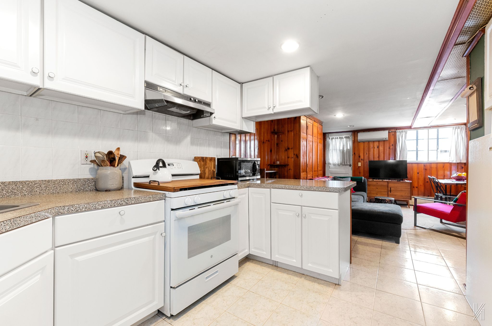 67-17 Eliot Avenue Queens, NY 11379 - Photo 15 of 21 a kitchen with white cabinets and appliances