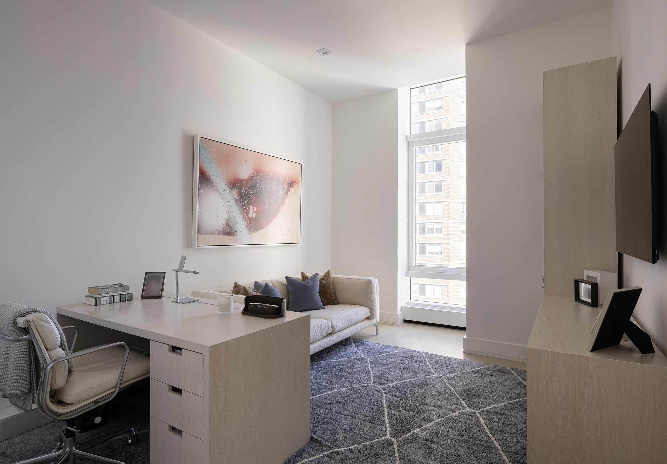 200 Amsterdam Avenue, Unit 17A Manhattan, NY 10023 - Photo 14 of 24 a living room with furniture and a flat screen tv