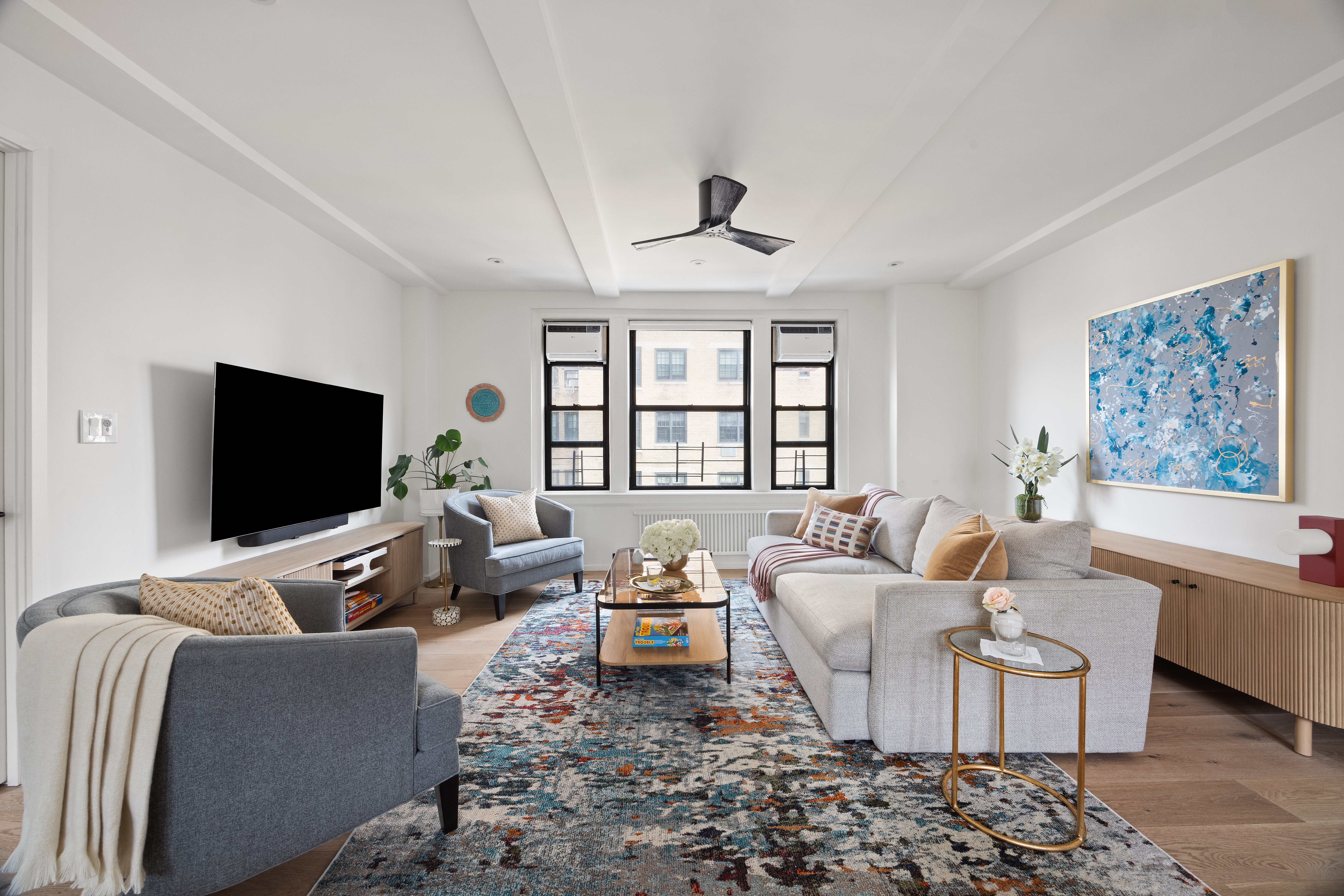 a living room with furniture and a flat screen tv