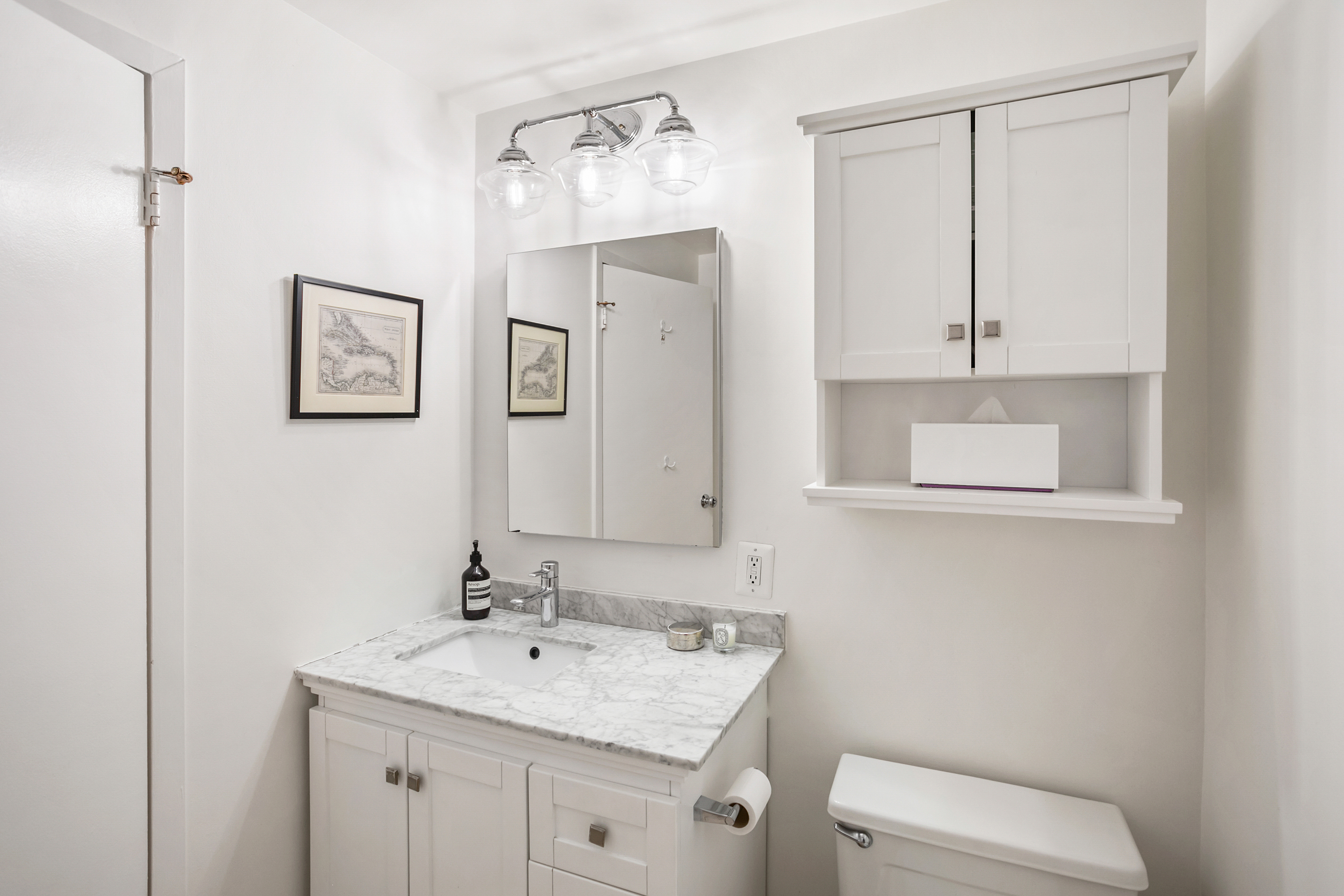 2123 California Street Northwest, Unit D5 Washington, DC 20008 - Photo 15 of 25 a bathroom with a toilet sink vanity and mirror