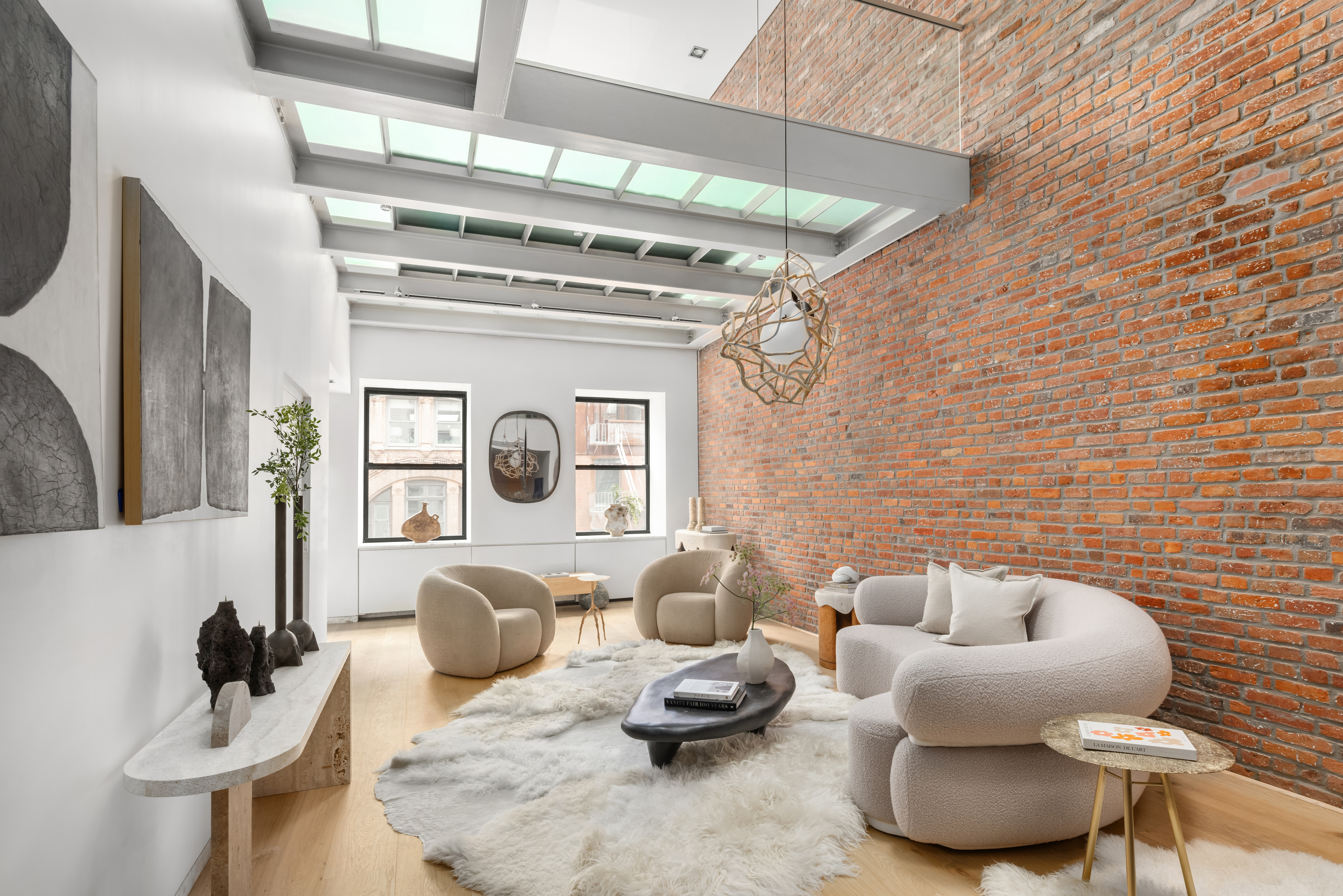 74 Warren Street, Unit 5W Manhattan, NY 10007 - Photo 4 of 15 a living room with furniture and a fireplace